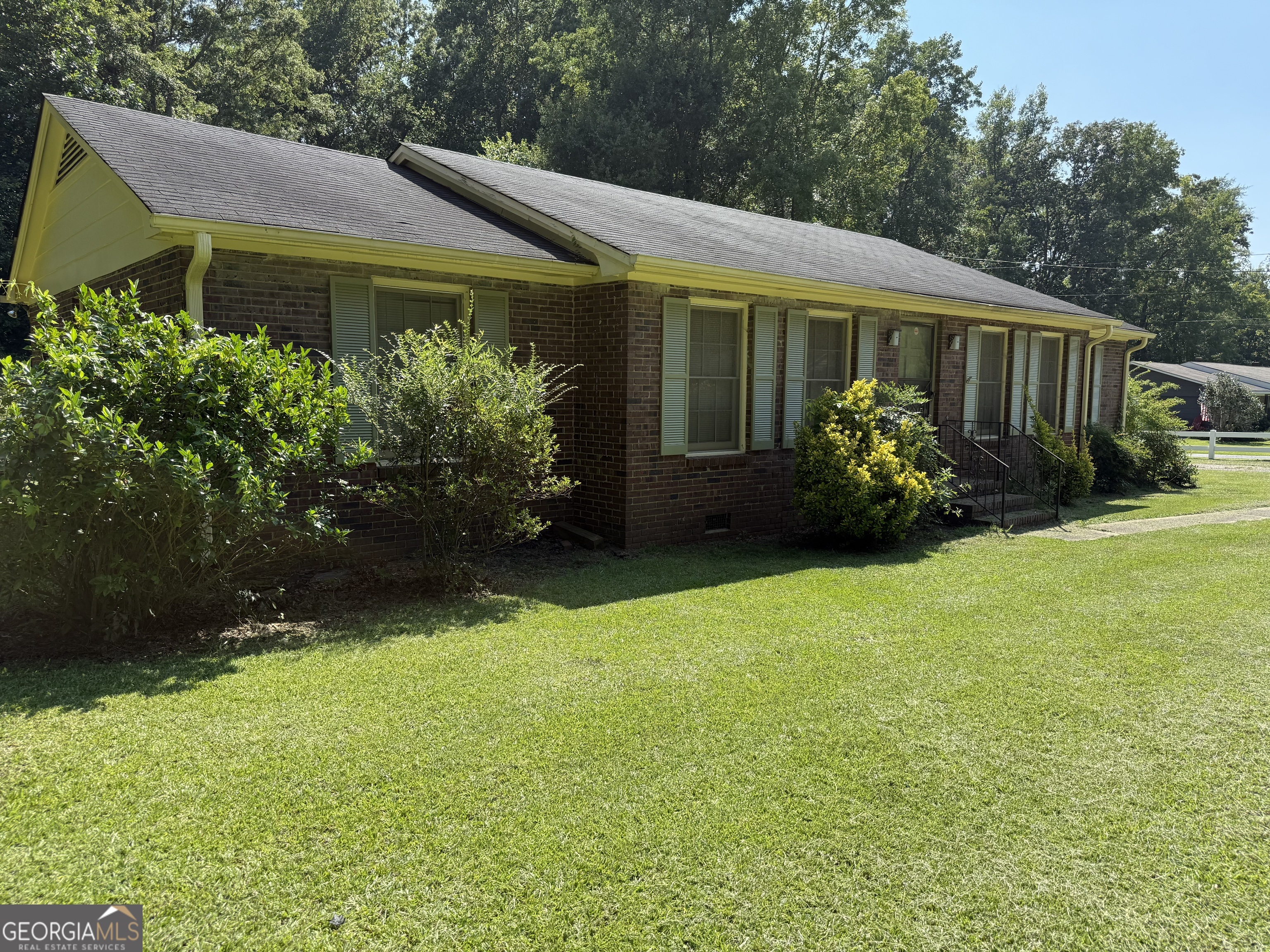 Come check out this solid, all-brick 3-bedroom, 2-bath ranch-style home with 1,580 square feet of comfortable living space. Tucked away on a quiet, peaceful street, this home offers a great mix of privacy and convenience-just minutes from lake access, shopping, dining, and more. Inside, you'll find a spacious layout that includes a separate dining room, a formal living room, and a cozy den-perfect for relaxing or entertaining. The home sits on a flat, level lot with an open carport and is surrounded by friendly, well-kept homes. It's been well cared for and is ready for someone to make it their own!