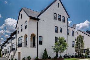 RARE FIND!! Luxurious END UNIT townhome in prestigious, GATED Serenade. Just 5 minutes from Alpharetta City Center and Avalon! Abundant windows in this gorgeous home offer lots of natural daylight and STUNNING VIEWS of the 6-acre park! Elegant brick townhome with a finished lower level that includes a den, bedroom, full bath and storage. Plus an amazing 4th floor Bonus Room and Sky Deck! Spacious floor plan with great storage. Beautiful designer kitchen has quartz countertops, stainless appliances, abundant cabinets and a huge island. Fireside family room opens to an oversized deck. Third level primary suite is large and features a luxurious bath with a large frameless shower, a free-standing soaking tub, double vanities and a large walk-in closet. A secondary en suite bedroom shares the third level. The top level offers a flex room/bedroom and has a full bath and sky deck with sweeping views of the park! Enjoy music from nearby Ameris Amphitheatre. Hardwoods and luxury plank flooring throughout the home. SERENADE AMENITIES include a swimming pool, cabana with covered patio and fireplace, plus access to the park with walking trails. PRIME LOCATION & PEACEFUL SETTING!! Enjoy walking and biking on the Alpha Loop (connects Alpharetta City Center to Avalon, Big Creek Greenway, and North Point area). You'll love the upscale lifestyle this community offers and all that Downtown Alpharetta and Avalon have to offer - just a few minutes away. Downtown Alpahretta features Saturday farmer's market, many restaurants, bars, shops, art and music festivals, Brooke Street Park, library, and more! Showings begin Saturday, August 9, 2025.