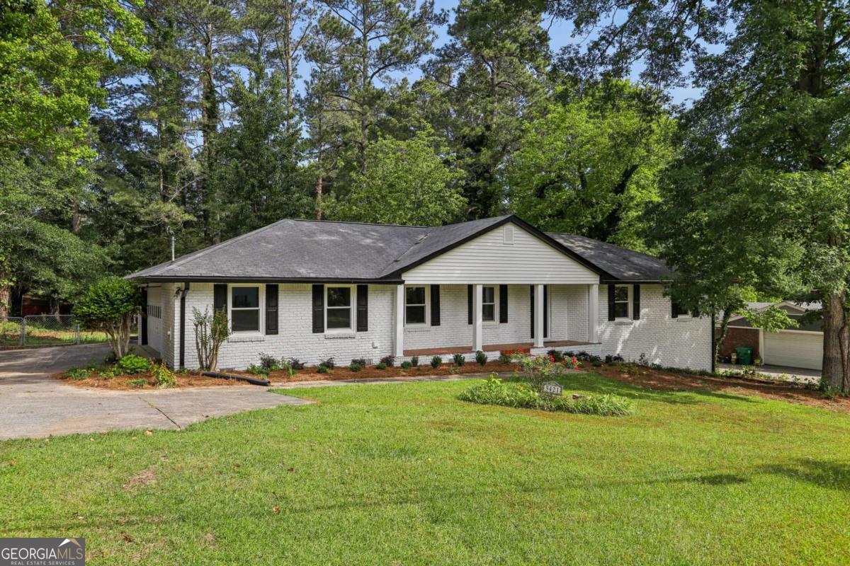 Property may qualify for 100% financing and/or up to a $7,500 down payment grant through Ameris Bank! Beautifully updated 3BR/3BA brick ranch in Parkview schools with brand-new roof installed in Sept 2025, all-new windows, and designer finishes throughout. Enjoy an open-concept living space with LVP floors, fresh paint, and a fully renovated kitchen featuring granite countertops, stainless steel appliances, farmhouse sink, and vent hood. All bathrooms are fully remodeled with spa-like details. Finished basement with private entrance with a full bath offers flexible space for guests or home office. Outside: a large fenced yard, a small shed, a screened porch, deck, and garage with workshop/flex area with laundry hookups. Minutes to Stone Mountain Park, shopping, dining, and highways. Truly move-in ready!