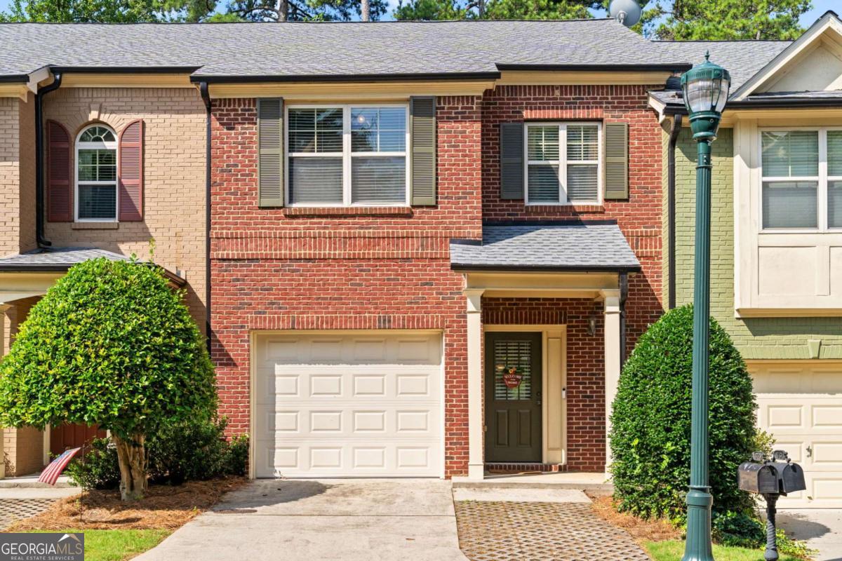 Chic, Turnkey, and Packed with Style - Welcome to 1729 Ridenour Pkwy! This Kennesaw gem delivers the lifestyle you've been waiting for. With 3 bedrooms, 2.5 baths, and 1,680+ square feet of designer living space, this townhome blends modern finishes with everyday comfort in all the right ways. The open great room with gas-start fireplace sets the tone - warm, welcoming, and perfect for hosting. Flow into a sleek dining area and tiled sunroom, then straight into the showstopper kitchen featuring granite countertops, stainless steel appliances, and rich hardwood flooring throughout. Upstairs, the primary suite offers a walk-in closet and a spa-inspired bath with double vanity, soaking tub, and separate shower, it's a true retreat. Outside, your private fenced courtyard with stone patio is made for cocktails, coffee, and everything in between. Located in sought-after Ridenour, with swim, tennis, playgrounds, and unbeatable access to shops, restaurants, and outdoor fun, this home is more than a place to live, it's a lifestyle move. Modern. Move-in ready.