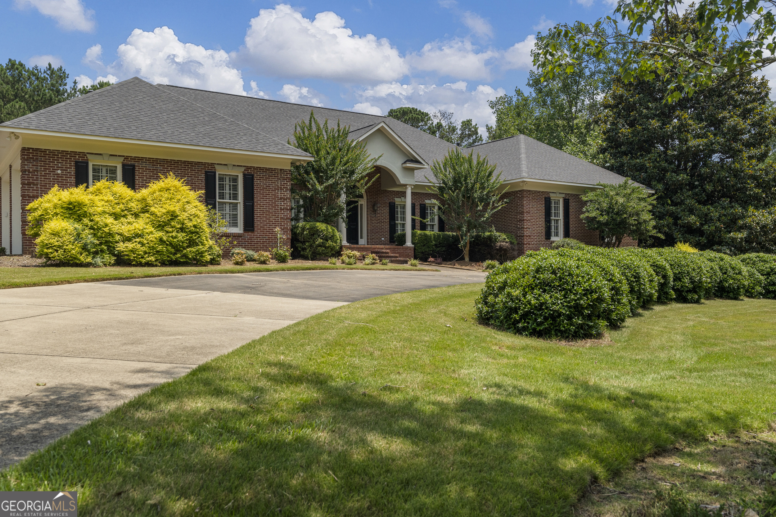 Luxury, Comfort, and Space Await in This Stunning Coca Lake Estate. Nestled in a quiet cul-de-sac on 3.55 beautifully landscaped acres, this exceptional Coca Lake home offers the perfect blend of upscale living and relaxed comfort. A circular driveway welcomes you to the property, connecting to the main drive and a 2-car attached garage for effortless access. Just in time for summer, step into your private backyard retreat featuring a 20x40 saltwater in-ground pool, complemented by a pool house complete with an outdoor wet bar, half bath, large storage room, and a 1-year-old hot water heater. Continue the fun with a basketball area, expansive deck, and a covered gazebo ideal for grilling and entertaining. For those who need extra workspace, you'll love the 16x18 brick workshop, all surrounded by a private, level backyard designed for enjoyment and seclusion. Inside, the home welcomes you with a large foyer and a stunning formal dining room that easily accommodates a 10-12. The updated eat-in kitchen features a breakfast bar, center island, and Sub-Zero refrigerator, overlooking a spacious screened-in porch perfect for casual gatherings. At the heart of the home is a warm and inviting great room with a fireplace, offering space for relaxing or entertaining. With 6 bedrooms, one has been set up as a gym, and a bonus room all on one level, there's space for everyone. The primary suite is a true retreat, boasting double doors, three walk-in closets, a soaking tub, separate shower, double vanity, and private access to a second screened-in porch with a hot tub. Additional features include a private staircase from the garage to an upstairs bonus room and walk-in attic, roof (home and outbuildings) only 4 years old, indoor water heaters (2 units) just 4 years old, HVAC units (8 years old) serviced in April 2025, septic system inspected and pumped April 2025.