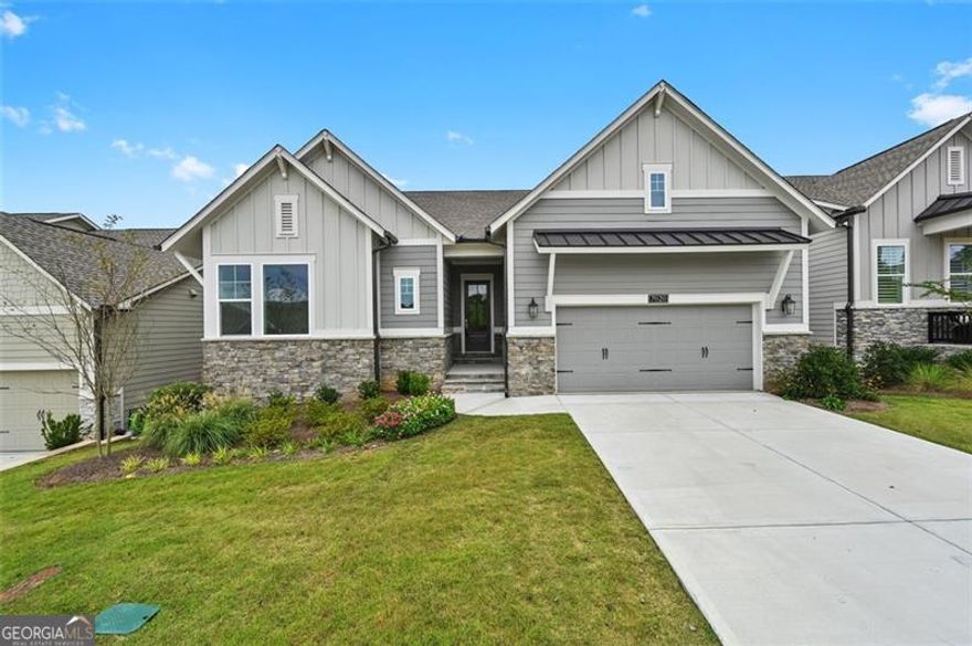 Like New Resale Home.  Step into a home that feels brand new-because it practically is. This immaculate resale property has never been lived in, offering all the benefits of new construction without the wait. Enjoy the privacy of both front and back sides, perfect for peaceful living. Inside, you'll find no carpet-only elegant hardwood flooring throughout, creating a sleek and allergen-free environment. The garage and entire basement have been upgraded with fresh epoxy flooring, adding durability and a clean, modern finish.Relax and enjoy the private, wooded view from your covered rear deck, or fire up the grill as you entertain on your covered rear patio. Speaking of entertaining, wait until you see this open-concept Keyser Plan with the 12' sliding glass doors taking you out to the deck. The huge kitchen island features quartz countertops & the resident chef will love the 36" 5-burner gas cooktop, designer stainless steel vent hood and built in in microwave and oven. The large open study is perfect for a media room. THE RETREAT AT STERLING ON THE LAKE IS 55+ LIVING WITH ADDITIONAL PRIVATE EXCLUSIVE AMENITIES INCLUDING CLUBHOUSE, POOL, FITNESS CENTER, TENNIS/PICKLEBALL COURTS LAWN MAINTENANCE IS ALSO INCLUDED. This is a rare opportunity to own a pristine home in move-in-ready condition. Don't miss your chance to make it yours!