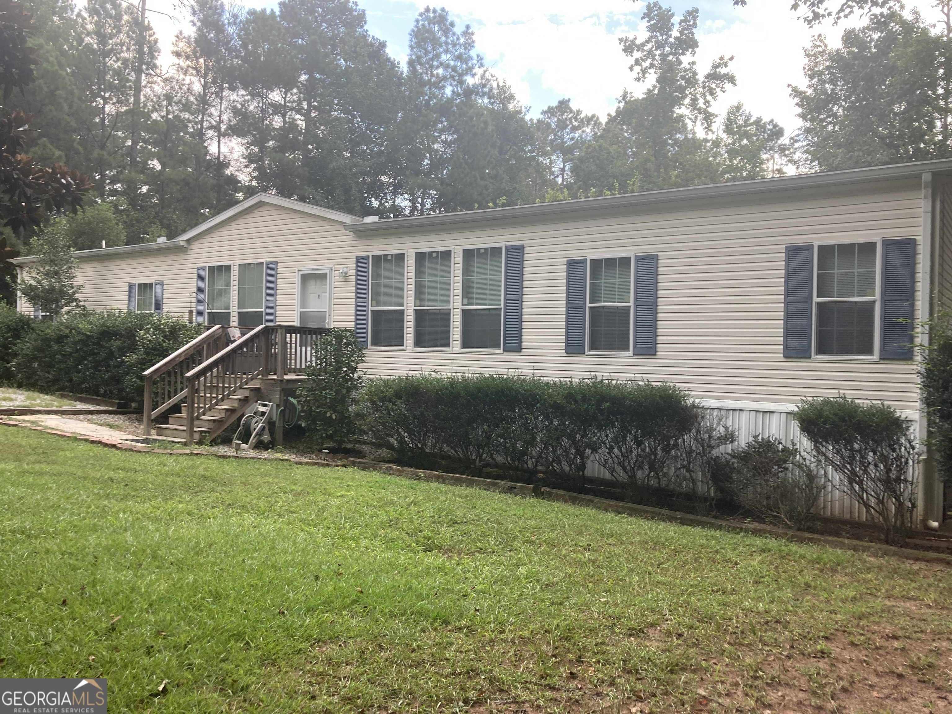 Home is 2013 custom built Champion home and is in immaculate condition. Home has a 12x16 screened in porch and a 32x36 garage/workshop. This home has lots of extras. The 1.47 acre lot has a rural atmosphere, DEEDED ACCESS to lake approximately 1/2 mile away. It is located between towns of Milledgeville and Eatonton and near Lake Oconee area in Greensboro, Ga. This home has so much to give. Call today to set up a showing.