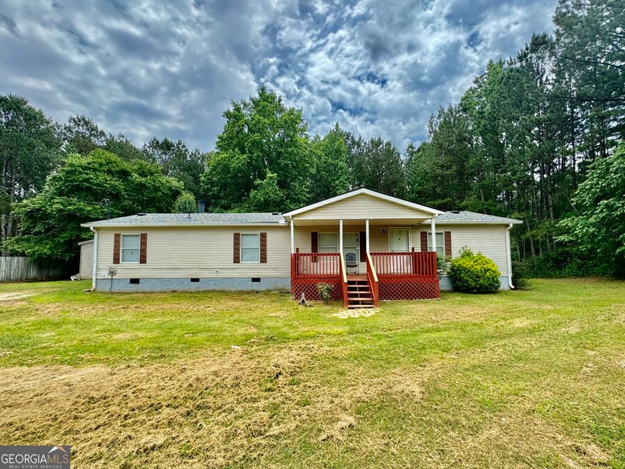 Motivated Seller! Renovated three bedroom, two full bath home on 2.99 acres. This home offers a private lot with a wide front porch. Open floor plan with lots of space. Open dining room area, open kitchen and open living room area. This home offers a split bedroom plan with the master suite and full bath with standing shower on one side, and two bedrooms with the other full bath on the opposite side. This home has a separate laundry room area and also a storage building. This home offers privacy in a rural setting.