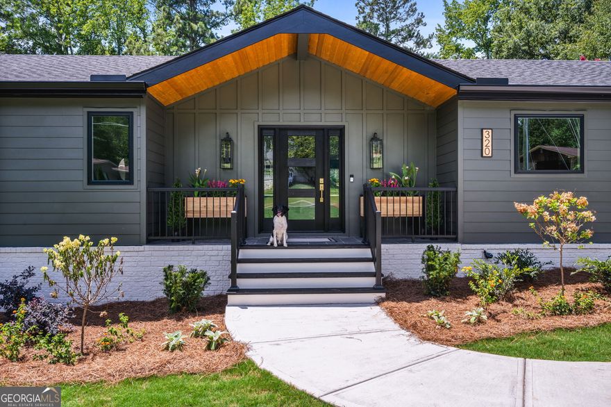 Welcome to your brand new, modern sanctuary in the heart of Downtown Alpharetta lovingly and meticulously rebuilt from the foundation up in 2025. This brand-new ranch-style home is as bright and open as it is refined, with soaring 14-foot ceilings, designer lighting, and custom finishes that set the tone for elevated living.    With a jackpot location and a spectacular half acre homesite, you're off to a great start.  The curb appeal is both sophisticated and clean.  Moody tones pair well with lush landscaping, natural cedar accents, slick exterior lighting and a custom glass doorway.    Inside, the open kitchen is a showstopper, with a slick FORNO appliance package, elegant waterfall counters, a timeless herringbone backsplash, smooth sight lines, and soft-close cabinetry-all designed for both style and function. You'll love how the kitchen cohesively stretches out with the coffee bar with an additional sink, ice maker and wine cooler.  This is how you design to entertain.  You'll also appreciate the matching laundry cabinetry, wet sink and an extra powder bath for your guests.  The elegant primary suite rests on the main floor, offering a spa-inspired retreat with a large walk-in shower, custom vanities and hardware, and a thoughtfully designed, walk-in closet system. Just down the hall, a beautiful guest suite with its own full bath ensures comfort and privacy for visitors.  The terrace level extends your living space with another recreation space, a kitchenette with a sink and beverage cooler, two spacious bedrooms, a full bath, and 800 square feet of unfinished space ready for your vision. The garage comes prewired for your electric vehicle, blending modern convenience with timeless design.  Out back, serenity awaits. A rare half-acre lot features mature landscaping, peaceful views of a private lake, and endless potential-whether you dream of a sparkling pool, flourishing gardens, or simply soaking in the calm.  All this just minutes from Avalon, Downtown Alpharetta's markets and dining, and award-winning schools. This home brings together high design, everyday comfort, and a location that feels like having it all.