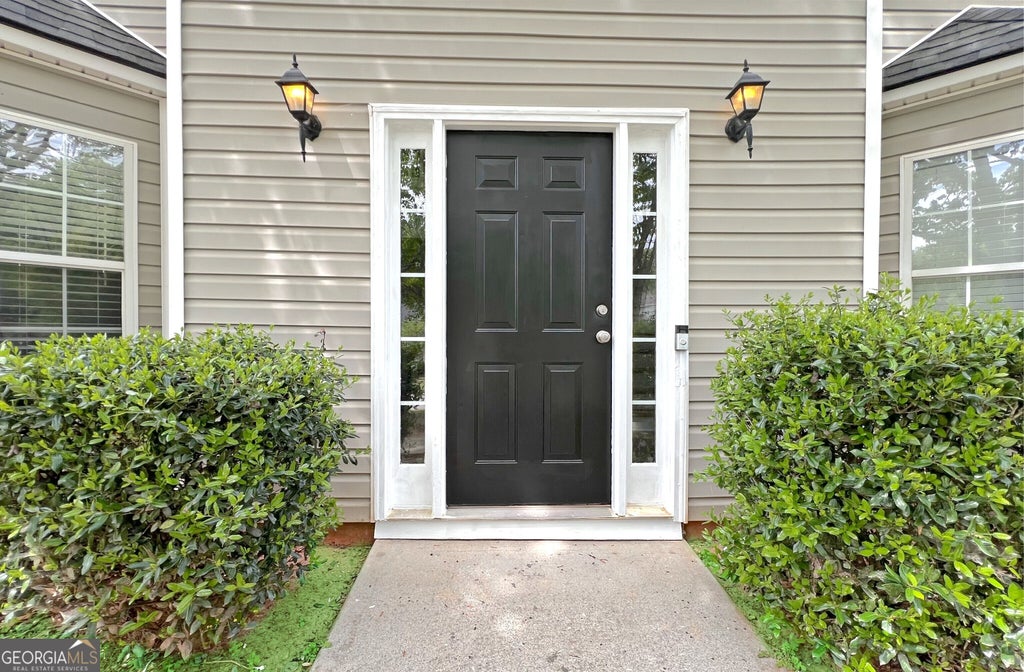 Photo of 5983 Hitt Lake Trail, Stone Mountain, GA 30087 (MLS # 10785578)