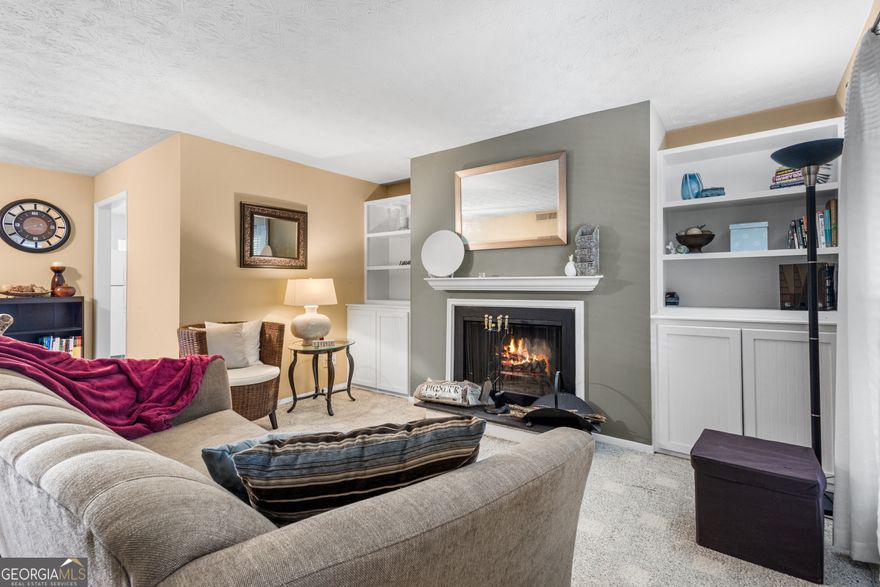 Great Opportunity for Easy Living!! This Spacious 2 Bedroom 2 Bath Condo with an Open Family room, bookcases, fireplace, and a Sunroom/ Open to Patio. Located in a Lush Expanse of Nature in the Chimney Trace Community. Great Location, Easy Access to The Battery, Truist Park, I-75 & 285 Highways.     Best of All, Marketplace Terrell Mill Opened Down the block- a mixed-use shopping and retail plaza with a New Kroger, Restaurants, and a Bar, just a Walk Away. This Charming Condo has an Open Concept Living & Dining Area. Nicely Open Kitchen with Appliances,  Laundry Closet with Storage. Washer & Dryer are a compliment. Sunroom Opened to Patio and Level Parking. The Two Large Bedrooms work well as a Roommate Plan Or Bedroom w/Walk-In Closet and Private Bath, and Guest Room/Office with Hall Bath. Enjoy the Pool and Greenways throughout. Move In Ready...Enjoy it All!     Welcome Home