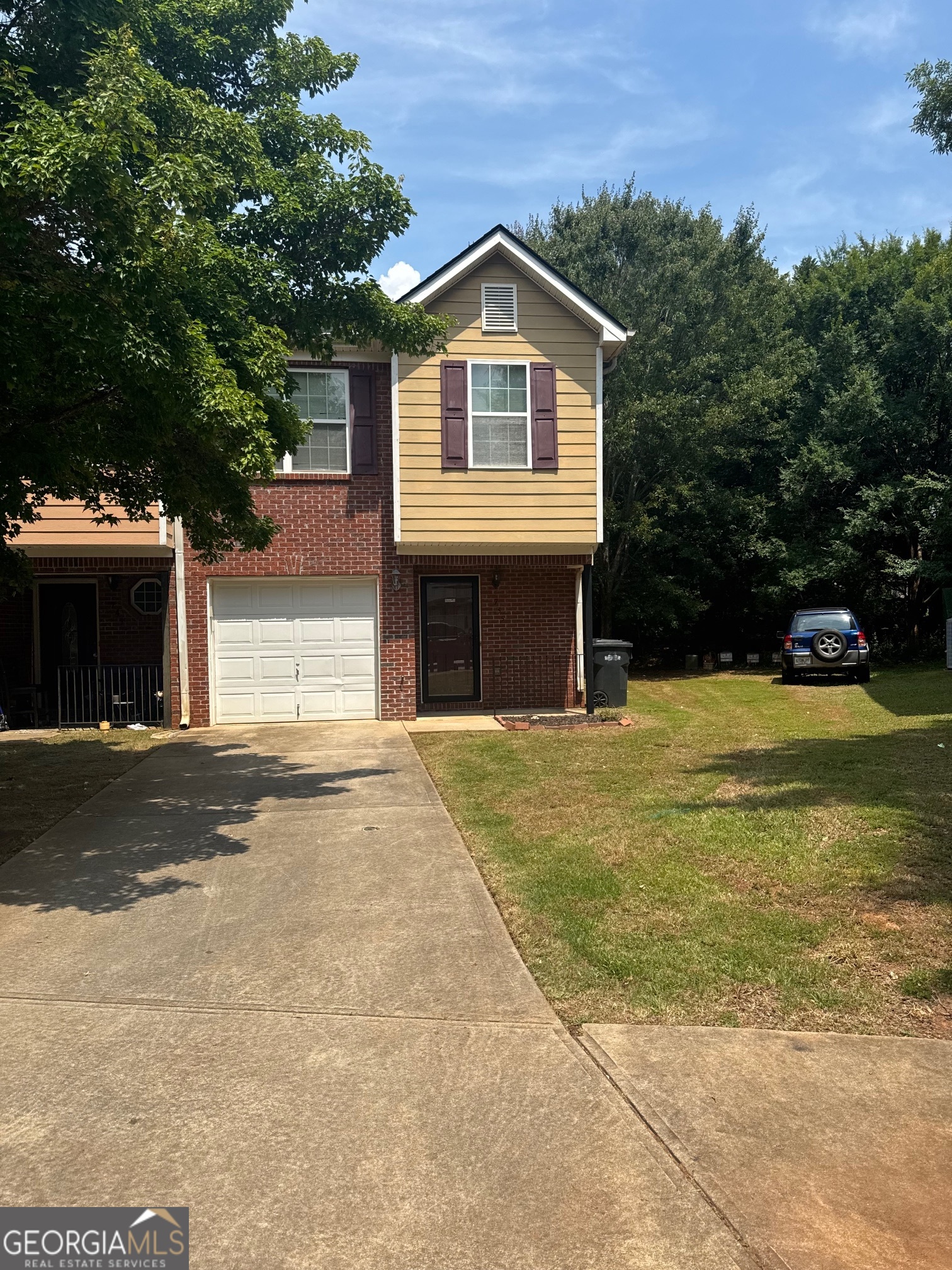 Welcome to this beautifully maintained 3-bedroom, 2.5-bath townhome located in the desirable Gardens at Magnolia Village subdivision. Offering the perfect blend of comfort and convenience, this home features a spacious layout designed for modern living. Step inside to a large family room with a clear view of the private backyard-ideal for relaxing or entertaining. The main level includes a convenient half bath, perfect for guests, while the upper level offers three generously sized bedrooms for ultimate privacy and comfort. Retreat to the owner's suite, where you'll enjoy a soaking tub with a combination shower, a walk-in closet, and a peaceful space to unwind after a long day. The attached single-car garage adds security and ease of access to your home. Located in a charming and well-kept community, this townhome is ideal for anyone looking to enjoy low-maintenance living without sacrificing space and style. Lets not forget to mention the brand new roof and AC Units! Don't miss this opportunity to own in one of the area's most sought-after neighborhoods-schedule your private showing today!