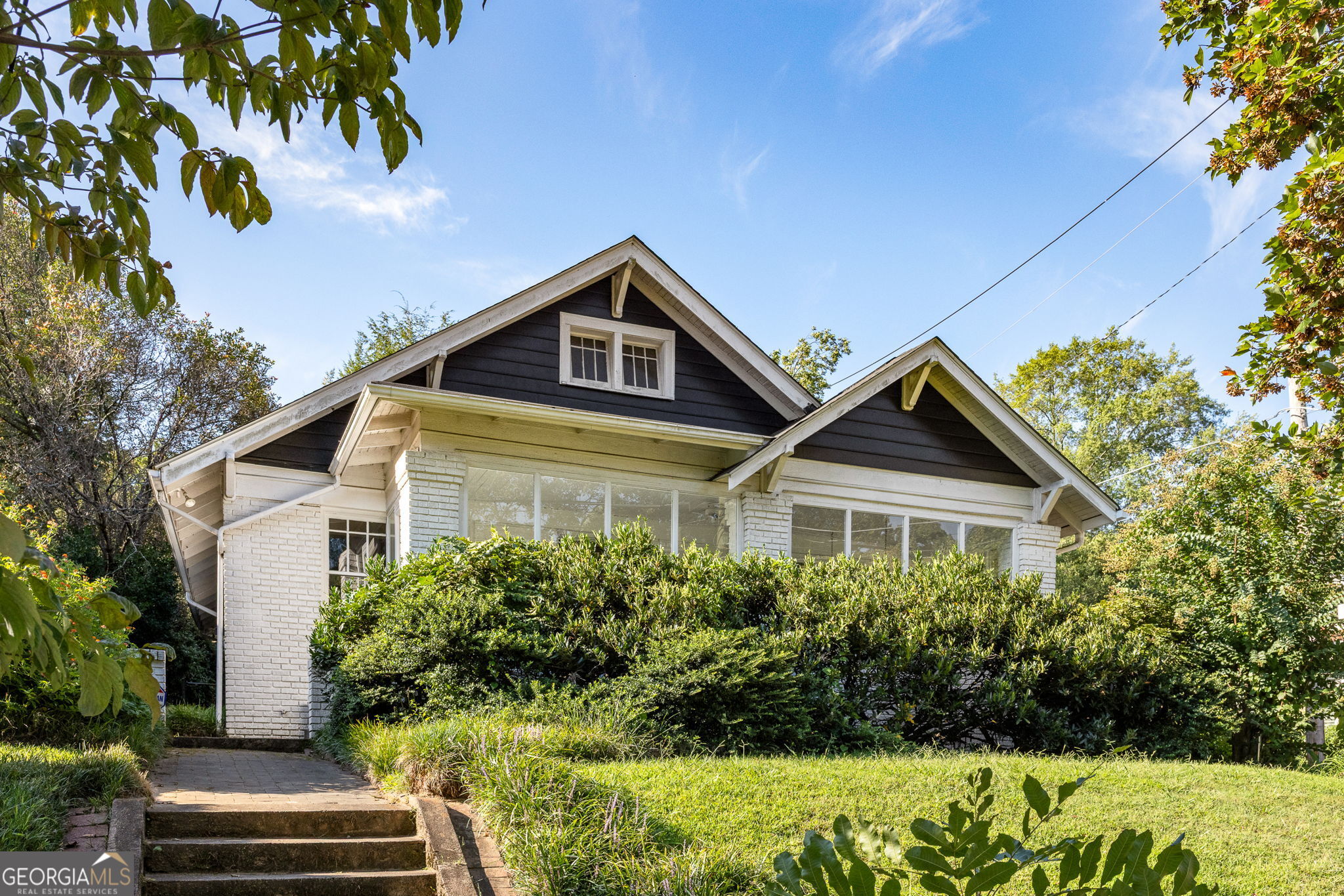 Charming Craftsman in the Heart of Candler Park Step into the warmth and character of this three-bedroom, two-bath Craftsman, where classic details and everyday comfort come together in one of Atlanta's most treasured neighborhoods. High ceilings, rich hardwood floors, and built-ins create a sense of timeless charm, while the large sunroom-washed in natural light-offers a cheerful space to gather, work, or simply unwind. The roof, replaced just four years ago, brings peace of mind, and the expansive unfinished basement provides plenty of room for storage. The detached double-car garage, tucked along a quiet side street, is a rare find. Here, life flows easily with Candler Park and award-winning Mary Lin Elementary only steps away, and local shops, favorite restaurants, and MARTA all close at hand. Known for its welcoming community, festivals, and leafy green spaces, Candler Park is a neighborhood that feels like home. With its inviting character, ideal location, and the added flexibility of an R5 lot, this is a home ready to be loved for years to come.