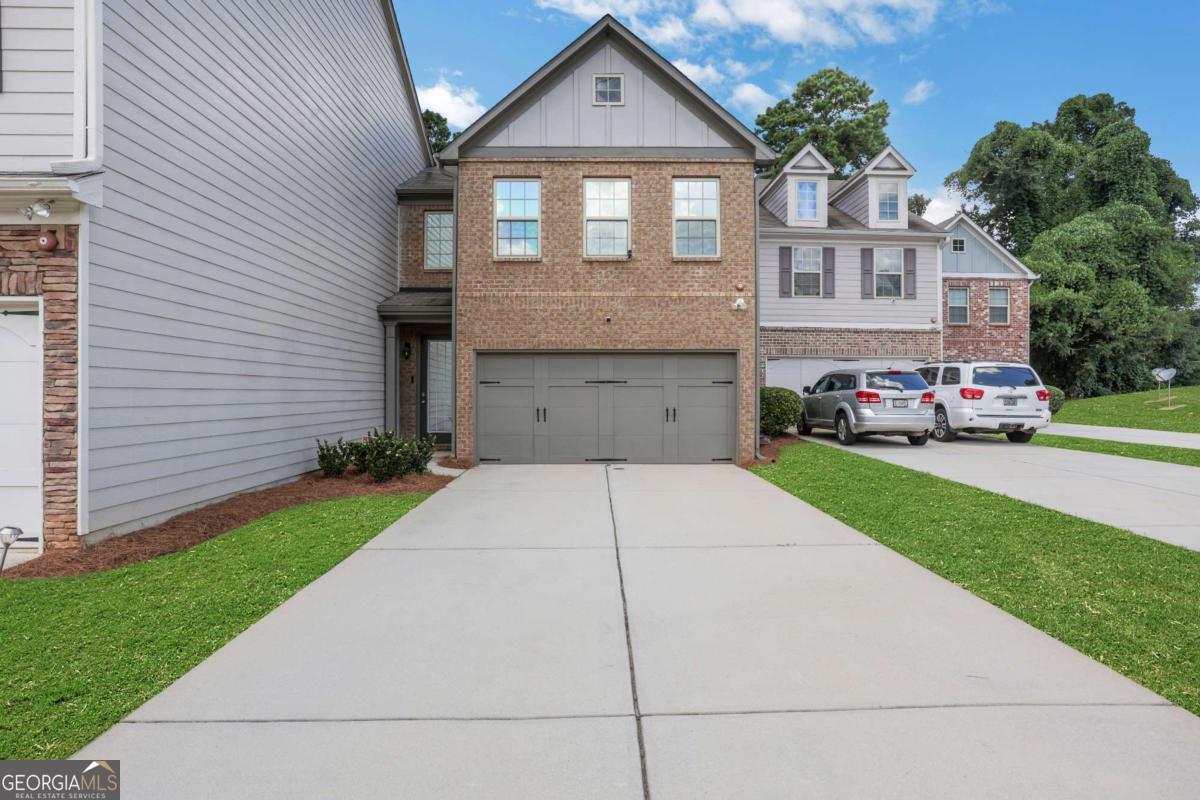 This spacious 3-bedroom, 2.5-bath townhome offers nearly 2,000 square feet of comfortable living in the Story Farms community in Norcross. The main level features hardwood floors, an open-concept layout, a cozy fireplace, and a fully equipped kitchen with granite countertops, custom cabinetry, and a walk-in pantry. Upstairs, the oversized primary suite includes a walk-in closet, dual vanities, a soaking tub, and separate shower, while two additional bedrooms, a full bath, and a flexible loft space provides plenty of room to spread out. A dedicated upstairs laundry room, a 2-car garage, extra-long driveway, while the spacious fenced backyard offers a rare outdoor retreat perfect for relaxing or entertaining. All within minutes of I-85, downtown Norcross, shopping, and dining. Contact us today to schedule a tour!