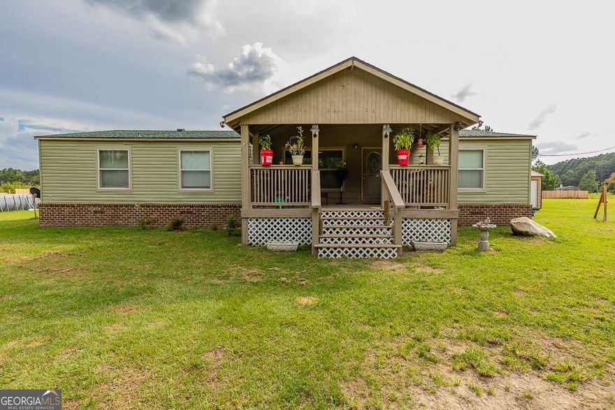 Looking for peace and quiet? Room to roam for you and your animals? Welcome to your dream country retreat! This 5.02-acre property is perfectly set up for horse lovers and homesteaders alike. With barn, stalls, riding pastures, and even a chicken coop, it's ready for your animals to settle right in. The heart of the property is a spacious 1,920 sq. ft. manufactured home, featuring 3 bedrooms, 2 full baths, a cozy living room and den and a front porch made for relaxing and enjoying the view. Updates include a brand-new roof, new fencing, and the home is in like-new condition-just move in and start living the country lifestyle you've been dreaming of! And when the work is done? Cool off in your above-ground saltwater pool-a perfect spot to unwind and enjoy the peaceful surroundings. This property has it all-space, functionality, charm, and room to grow. Don't let this one pass you by-come see it today!
