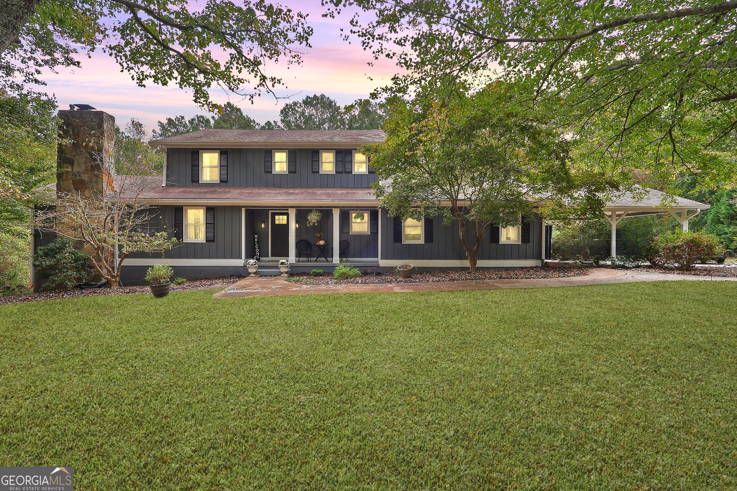 This stunning 5-bedroom, 4-bath farmhouse sits on 1.1 beautiful acres and offers an exceptional blend of custom design and modern comfort. The heart of the home is a professionally designed gourmet kitchen featuring a gas cooktop, double ovens, two dishwashers, built in microwave, an expansive custom-built pantry, and a large island with abundant seating. Sunlit windows surround the space, which flows seamlessly into the formal dining room and an impressive, window-filled great room with a stone fireplace. From there, step onto the screened porch-perfect for relaxing or entertaining. The main-level owner's suite includes a separate vanity area and spacious layout. An additional main-level suite (ideal for guests or in-laws) offers a full tile bath and private sitting area, plus a separate private entry. Upstairs, you'll find three oversized bedrooms and a large full bath with dual vanities. The partially finished basement includes a versatile flex space-perfect for a gym, office, or playroom-plus a full bath and generous storage area. Outdoors, enjoy endless options for relaxation and entertaining: unwind on the charming front porch, host gatherings on the expansive deck, or take in the serenity of the large, private backyard-ideal for play, gardening, or peaceful evenings under the stars. This home truly has it all-custom craftsmanship, thoughtful design, and an unbeatable setting. A must-see!