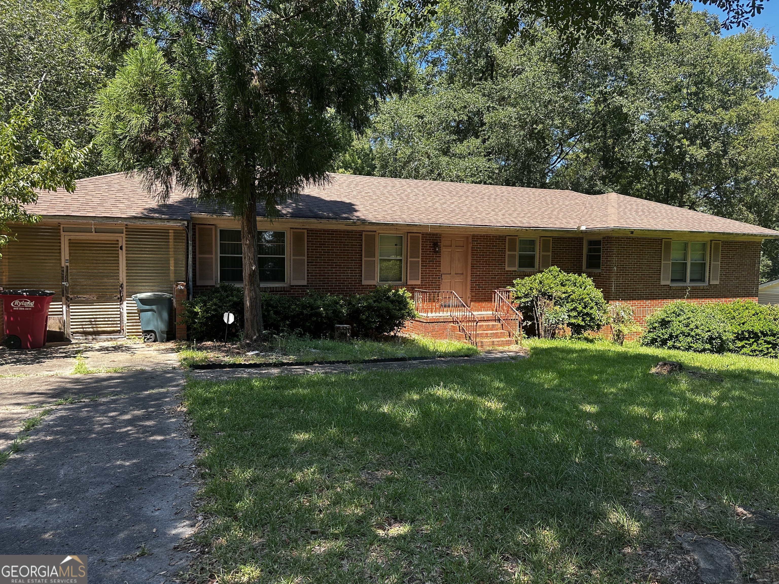Welcome to this adorable brick home that's full of character and possibilities! Featuring original hardwood floors, a spacious finished walk-out basement, and a great fenced backyard on nearly half an acre, this property offers both charm and privacy-nothing but trees behind you! The main level includes 3 bedrooms and 2 full baths, while the finished basement provides even more flexibility with an additional potential bedroom, another full bath, and plenty of space to spread out. Conveniently located less than a mile from Ingleside Avenue and just minutes from Riverside Drive, you'll love being close to shopping, dining, and everything Macon has to offer. This home is a true gem with room to grow-schedule your showing today!