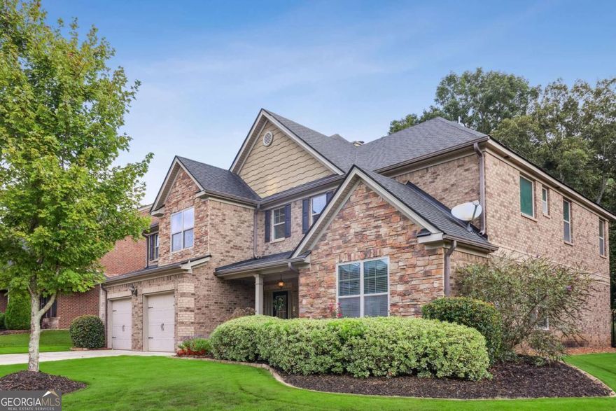 Welcome to this stunning two-story, three-sides brick home offering luxury, functionality, and timeless charm. Featuring 5 spacious bedrooms, 5 full bathrooms, and a half bath, this home is designed for both comfort and sophistication.    Step inside to discover two primary suites, including one conveniently located on the main level, perfect for multi-generational living or guest accommodations. The family room boasts a beautiful coffered ceiling, creating an inviting space for gatherings, while the separate dining room and den add elegance and versatility for entertaining or work-from-home needs.    The gourmet kitchen is the heart of the home, complete with a an island, abundant cabinetry, and a clear view to the family room, ensuring you never miss a moment with loved ones.    Enjoy outdoor living at its finest on the stone-paved patio beneath a charming pergola, ideal for relaxing or dining al fresco. Fenced back yard. Located near Mulberry Park, residents can take advantage of its sporting facilities, walking trails, and recreational areas. A swim membership is also available through a nearby pool, providing the perfect summer retreat.    Situated close to top-rated schools, this home combines elegant design, modern convenience, and an unbeatable location - a perfect place to call home.