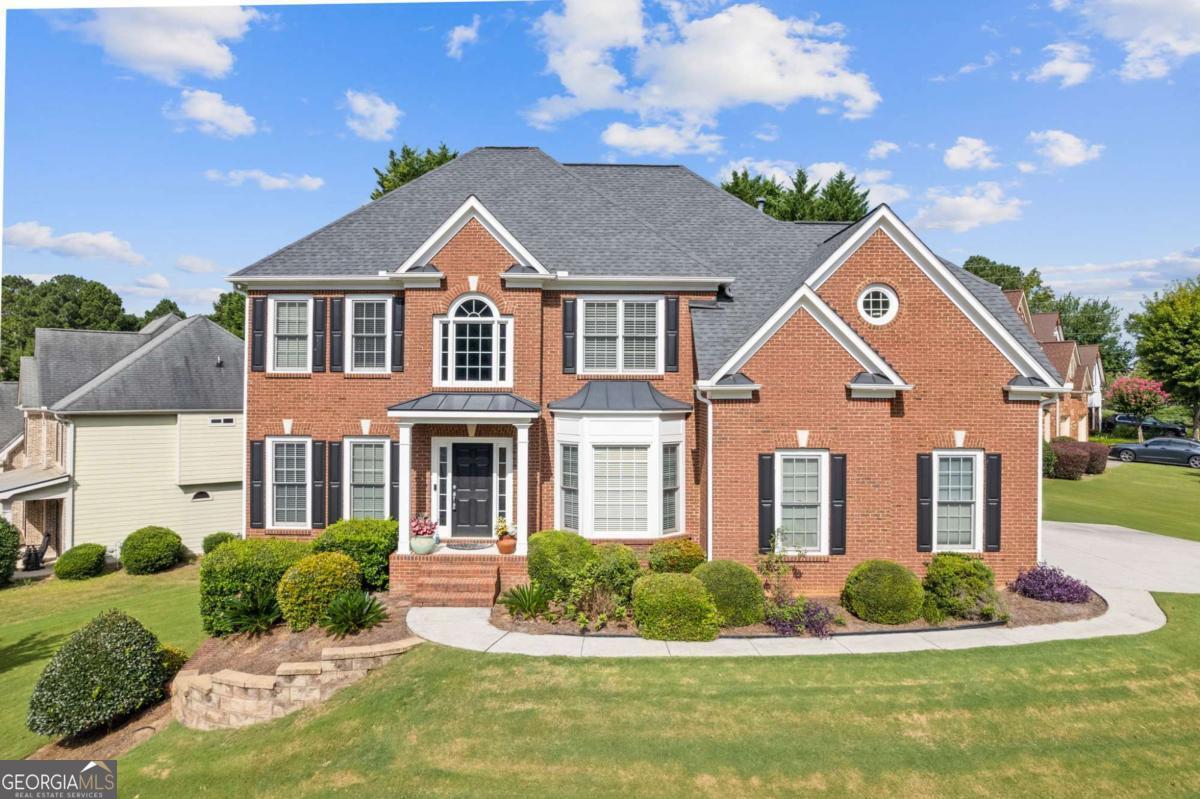 Located in the desirable Oakbrooke at Hamilton Mill community, just minutes from I-85, this spacious 6-bedroom, 4-bathroom FRESHLY PAINTED airy home offers exceptional space, comfort, and functionality across three levels. The main level features an inviting dramatic two-story foyer, formal living and dining rooms, and a bright, newly carpeted family room with direct views into the BEAUTIFULLY REMODELED DREAM KITCHEN. This kitchen includes a custom island, walk-in pantry, and plenty of space for cooking and gathering. A guest bedroom and full bathroom on the main level provide added flexibility. Upstairs, a catwalk overlooks the main level and leads to the oversized primary suite with tray ceilings, a cozy fireplace, and a LUXURIOUSLY REMODELED ENSUITE BATHROOM. The primary bath includes dual separate vanities, a frameless glass shower, soaking tub, and a REDESIGNED AND EXPANDED WALK IN CUSTOM CLOSET. Three additional secondary bedrooms and a full bathroom complete the upper level. The partially finished basement level offers a large recreation room, one additional bedroom, an office and a full bathroom-ideal for guests, a home gym, or multi-generational living. Enjoy outdoor relaxation or entertaining on the back deck overlooking the yard. As part of Hamilton Mill, Oakbrooke residents enjoy access to resort-style community amenities including two clubhouses, Junior Olympic-sized pools, 14 lighted tennis courts, pickleball courts, basketball and volleyball courts, walking trails, playgrounds, and a private fishing lake. There are also year-round social events and sports leagues-perfect for active, connected living. This is a rare opportunity to own a beautifully designed, spacious home in a vibrant, amenity-rich community. Schedule your showing today! Discounted rate options and no lender fee future refinancing may be available for qualified buyers of this home.