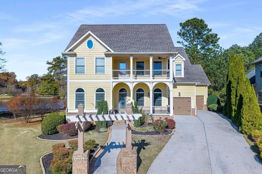 Gorgeous Craftsman on the Lake! Long driveway with plenty of parking and a welcoming front porch. Inside features a wide foyer with a flex/office space and guest bedroom with full bath. Separate dining room with double-sided fireplace opens to the spacious family room filled with natural light. Enjoy lake views from the screened-in porch! Chef's kitchen with large island, stainless steel appliances, pantry, and tons of cabinet space. Upstairs offers an open loft leading to the front terrace, two bedrooms with private baths, and a stunning owner's suite with fireplace, sitting area, screened porch, spa bath, and custom closet. Finished basement includes a full apartment with 2 bedrooms, kitchen, family room, bath, laundry, and storage. 3-car garage and outdoor fireplace area-perfect for entertaining. This home truly has it all!