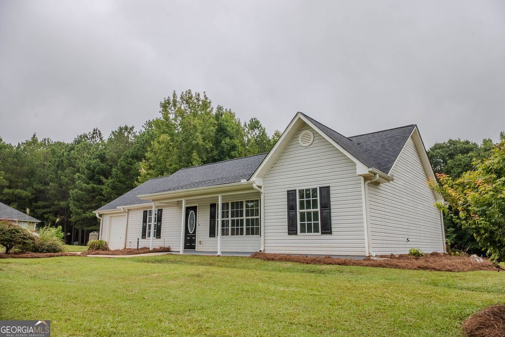 Photo of 156 Whispering Pines Trail, Milner, GA 30257 (MLS # 10880516)