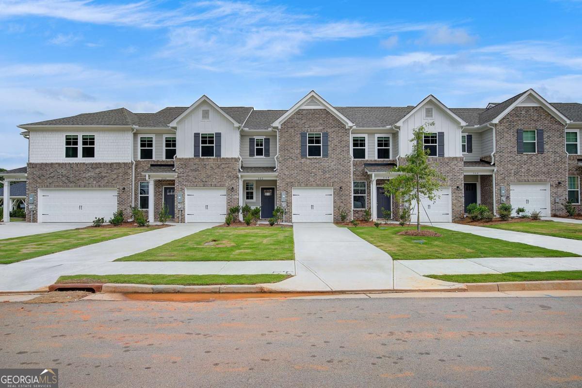 Welcome to Avery Landing by DRB Homes - your new home in the highly sought-after McDonough area! This beautifully crafted single-family townhome combines style and functionality, with no detail overlooked. The spacious Braden floor plan offers 3 bedrooms, 2.5 bathrooms, and an open-concept main level perfect for modern living and entertaining. The gourmet kitchen is a true showstopper, featuring a large island with quartz countertops, stylish painted cabinetry, and a generous pantry for storage. Upstairs, the inviting owner's suite includes a sizable walk-in closet, dual vanities, and a sleek tile shower. Enjoy the convenience of included stainless steel appliances-side-by-side refrigerator, range, microwave, dishwasher-plus a washer and dryer. Additional highlights include a one-car garage with opener and a private patio-ideal for outdoor relaxation. Avery Landing offers the perfect blend of comfort, design, and convenience. Schedule your tour today! Please note: If the buyer is represented by a broker/agent, DRB REQUIRES the buyer's broker/agent to be present during the initial meeting with DRB's sales personnel to ensure proper representation.