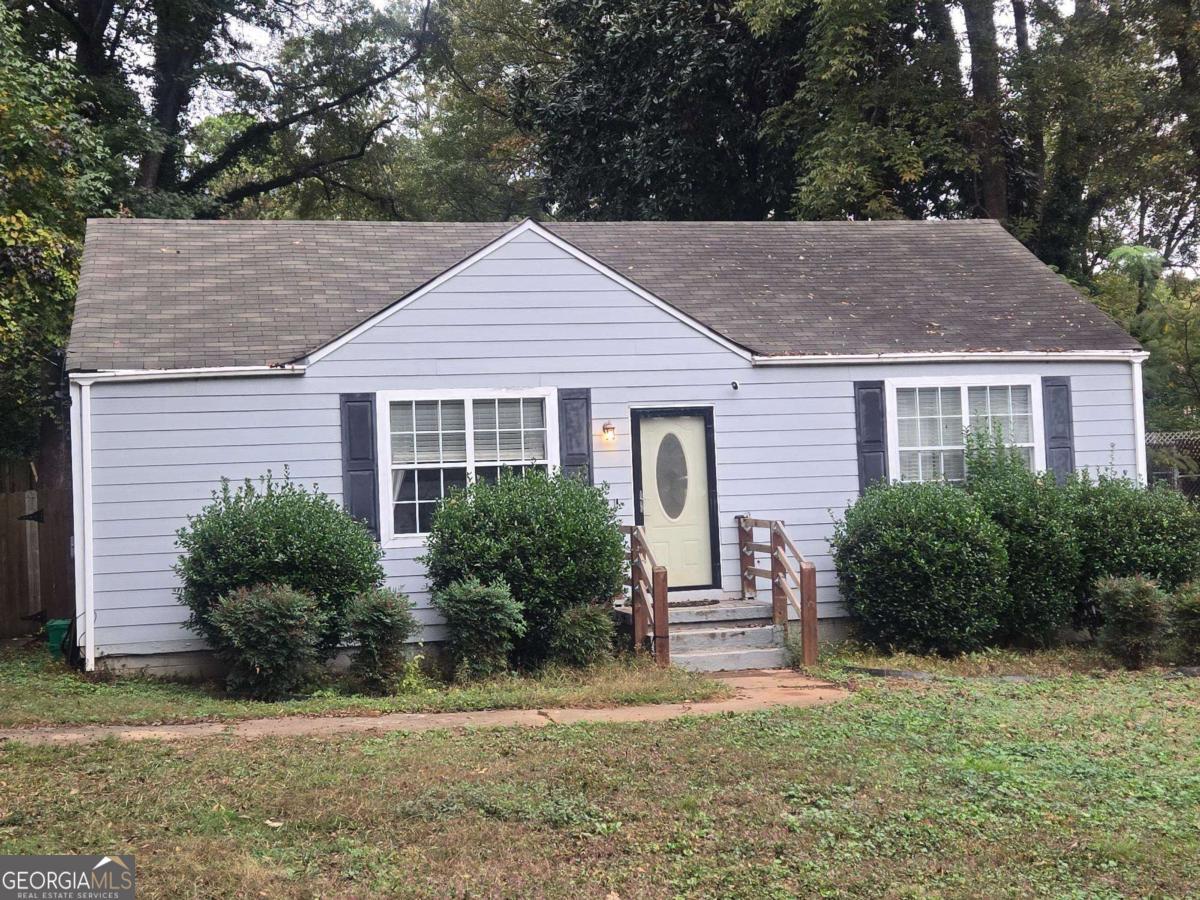 Welcome to this beautifully updated resale, perfectly situated just minutes from I-20, the City of Decatur, and some of Atlanta's most vibrant neighborhoods, shopping, dining, and nightlife. Step onto the inviting front porch and into a bright, open-concept layout featuring a spacious living and dining area with durable LVP flooring and abundant natural light. The modern kitchen boasts rich espresso cabinets, granite countertops, and stainless-steel appliances-ideal for both everyday living and entertaining. Just off the kitchen, you'll find a convenient laundry room with extra storage that leads to a rear patio overlooking a fenced-in backyard shaded by majestic oak trees-your own private outdoor retreat. The oversized primary suite on the main level offers comfort and style with dual vanities, a tiled shower, and a generous walk-in closet. Two additional guest bedrooms and a well-appointed guest bath complete the home's functional layout. This home delivers incredible value in a sought-after location. Don't miss your chance to own a move-in-ready gem at a budget-friendly price. Schedule your private tour today and make this house your home!
