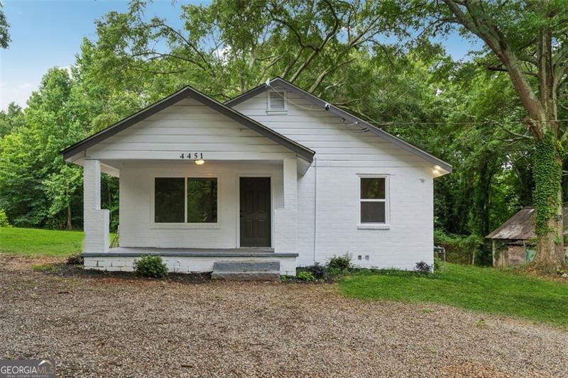 Stop the SCROLL! You have got to see this Iconic 1940's style home with it's jazz era vibes! Convenience and location are just the beginning of great things this home offers. It's freshly remodeled interior, clean crisp exterior, lush green surroundings and minimalistic style is ready to be Your Home Sweet Home!! This cozy 3 bedroom 2.5 bath home offers an open floorplan, luxury vinyl flooring throughout, quartz countertops, new cabinets, new vanities, new appliances, and tile baths and shower. All the trendy updates you are looking for makes this home a show stopper. It sits on a spacious 1.7 acre lot which is a rare find in Decatur. You have room to explore, garden, or fence in so the fur babies can run and play. The possibilities are endless! If you have family you would like nearby, take a peek at the home listed next door at 4443 Flat Shoals Pkwy or the vacant lot listed at 4459 Flat Shoals Pkwy with its own 1.7 acre lot. This would be a great opportunity to have your kids, parents, and even friends nearby while having your own space too. It is a rare opportunity! The only thing missing is you so start packing and call for a showing today!