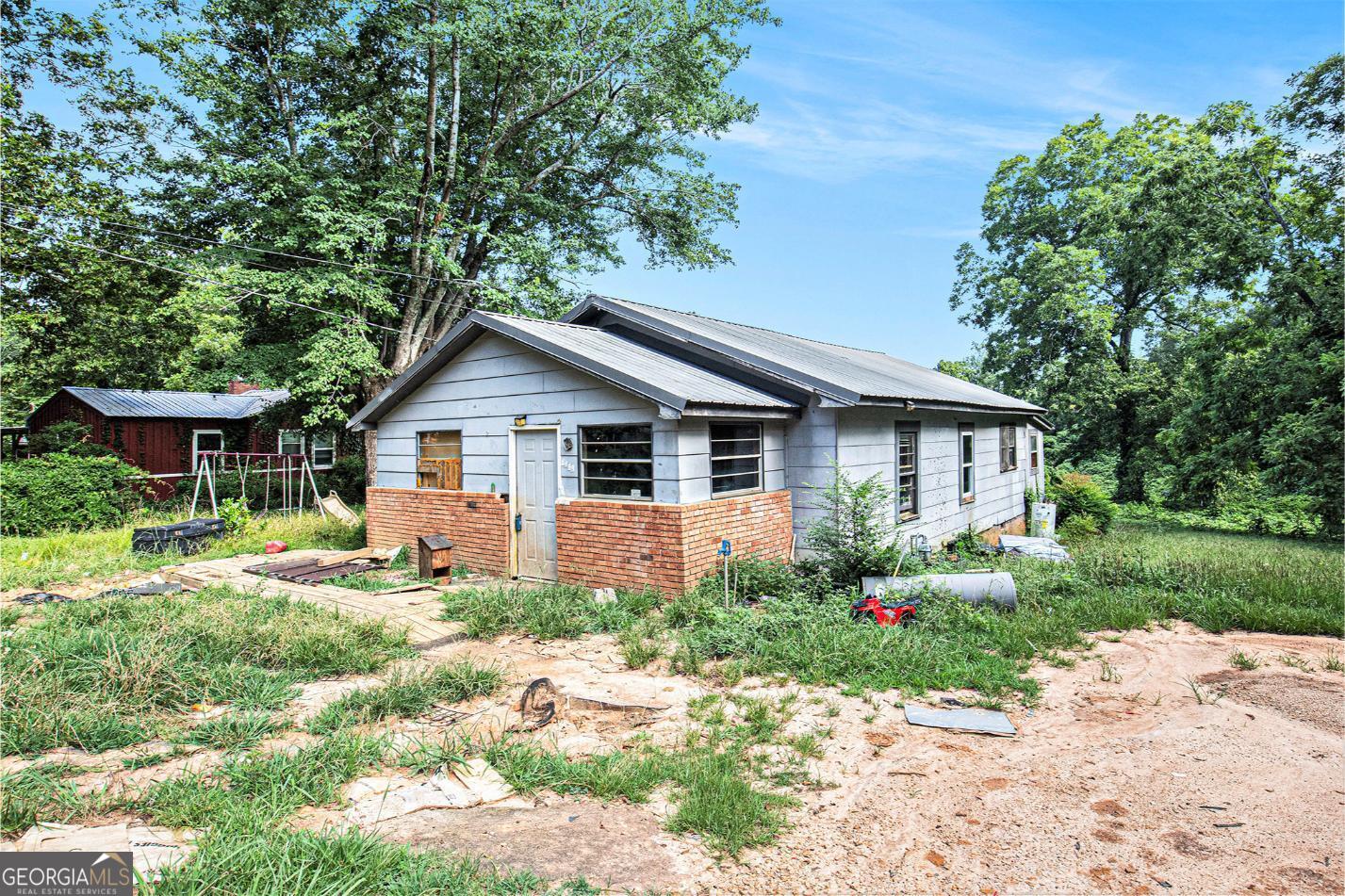 Located just minutes from historic downtown Toccoa, this 3-bedroom, 1-bath home sits on a level lot with tons of potential for the right investor or handy homeowner. The property is in need of significant repairs and is being sold as-is, but with some vision and elbow grease, this could be transformed into a charming home or rental property. Highlights: Walking distance to downtown and local shops Public utilities already connected Spacious backyard with mature trees Solid layout ready for renovation Whether you're looking to flip, rent, or rebuild, this is your chance to bring new life to a property in a growing Northeast Georgia community. Priced to sell - don't miss your chance to turn this diamond in the rough into your next project!