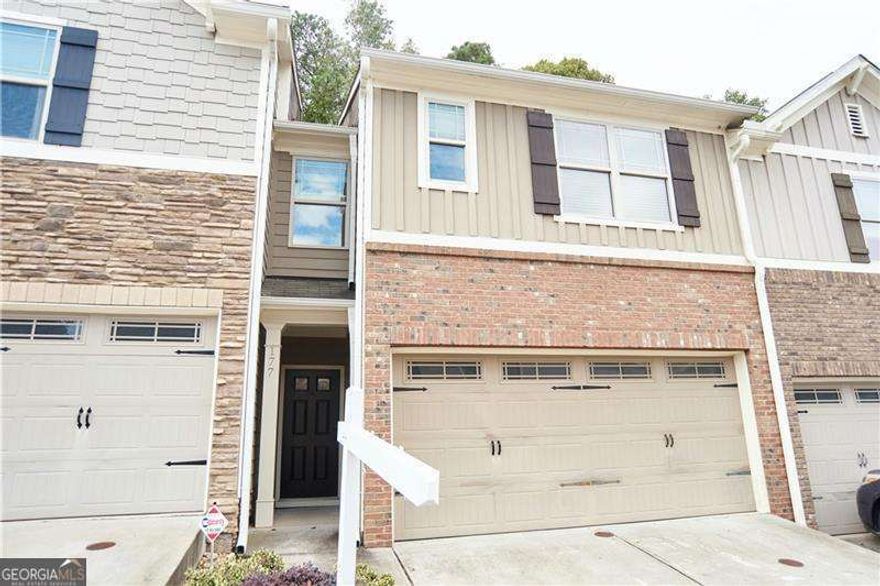 Welcome to Townview Commons, where easy living meets modern charm. This 3 bedroom, 2.5 bath townhome feels brand new, freshly painted from top to bottom and ready for its next chapter. The main level offers bright, open living with plenty of natural light and seamless flow, perfect for entertaining or just stretching out after a long day. The kitchen features stainless steel appliances, a classic subway tile backsplash, and a layout that keeps everything within reach. Upstairs, the primary suite is a true retreat, spacious and private with a spa-like bath designed for relaxation. Two additional bedrooms offer versatility for guests, a home office, or a creative space that is all your own. Outside, enjoy an expanded patio area ideal for morning coffee, grilling, or simply unwinding under the sky. The community pool and maintained grounds mean less work and more play, while the convenient location near I575 keeps you close to everything. When you are ready to explore, Downtown Woodstock is just minutes away, full of vibrant restaurants, breweries, shops, and year-round events.  This home blends comfort, convenience, and character in one unbeatable package. Do not wait, schedule your showing today and make Woodstock living yours. Some images AI staged furniture