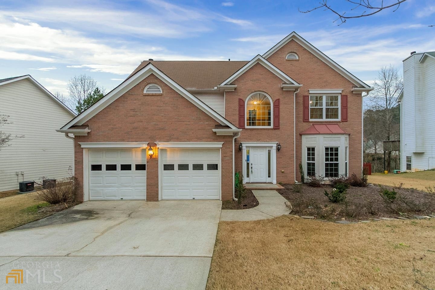 This Suwanee two-story cul-de-sac home offers granite countertops, and a two-car garage.