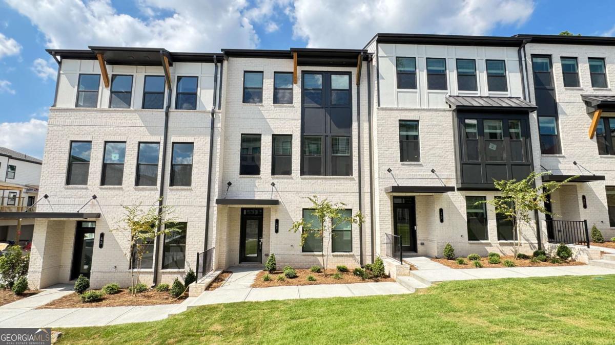 $2,695 Reduced Price for Quick Move-In ~ Welcome to the sought-after community of Henson Square ~ You can now rent for less than you can purchase ~ 4 Bedroom/3.5 Bathroom Townhome~ Upscale New Construction Townhome within walking distance to Downtown Lawrenceville Lawn. This gorgeous townhome sits in a park-like setting at the entrance to Rhodes Jordan Park. On the lower level is a spacious bedroom and a private bathroom. Upstairs, you have a stunning kitchen with white cabinets. This huge kitchen island comfortably accommodates four barstools and opens up to the outside deck, which is partially covered and features a ceiling fan, allowing you to relax and enjoy the outdoors. You also have a large walk-in pantry and powder bath conveniently located off the kitchen area. To complete this level, you have an expansive dining room that can easily accommodate a table for 8 and opens up to the family room, overlooking the courtyard and green space. Upstairs, you have the master bedroom, which also overlooks the courtyard and the master ensuite with a double vanity and tile surround master shower. At the end of the hall is the laundry room, and 2 additional guest bedrooms with a shared bath. Make this gorgeous townhome yours, and enjoy the convenience of Downtown Lawrenceville, which offers a multitude of restaurants, shops, free concert series, family events, and parties in Downtown Lawrenceville at The Lawn ~ (See photos in the listing), and enjoy the great outdoors with Rhodes Jordan Park, offering 162 acres of nature and 1.9 miles of walking trails. Rental Criteria: Verifiable Income of 3 times the rent, Excellent Rental History, and no late credit on credit report in the last 2 years. Pets are accepted on a case-by-case basis. Driving Directions: GPS to 100 E. Crogan Street, Lawrenceville. You enter the park entrance, and the community will be on your right. (Photos are of a different unit; the actual home has white kitchen cabinets).