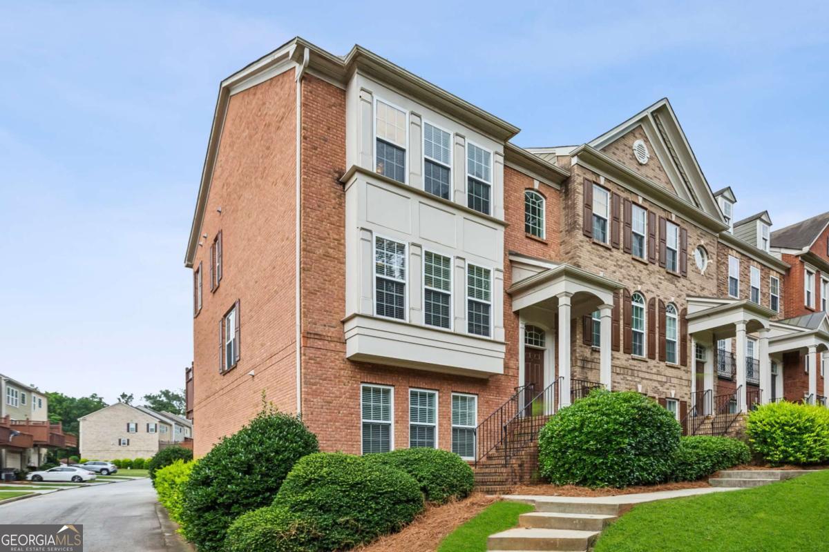 Welcome to 2149 Shoop Court - an inviting light-filled end-unit townhome tucked away in the heart of Smyrna's sought-after Park Avenue community. From the moment you step inside, you'll feel the perfect blend of warmth, elegance, and functionality in this thoughtfully designed three-level home. Offering 3 spacious bedrooms and 3.5 baths, this home is ideal for those who value both privacy and a sense of connection. The open-concept main level is an entertainer's dream, featuring rich hardwood floors, high ceilings, and abundant natural light that floods the living space. The inviting family room centers around a cozy gas fireplace and flows effortlessly into the chef's kitchen - complete with granite countertops, stainless steel appliances, a large island with seating, and a charming breakfast nook. Upstairs, you'll find a peaceful primary suite retreat with a tray ceiling, walk-in closet, and a spa-like bath featuring dual vanities, a soaking tub, and a separate tiled shower. A second en-suite bedroom is also located upstairs, while a third private bedroom and full bath on the lower level offer ideal space for guests, a home office, or a quiet workout area. The two-car garage and ample storage add convenience, while the private rear deck provides a perfect spot to unwind with morning coffee or evening wine. Residents enjoy access to the beautifully maintained community pool and green spaces - all just minutes from Smyrna Market Village, The Battery, Truist Park, and easy access to I-285 and I-75. Whether you're looking for low-maintenance luxury or the perfect place to host friends and family, 2149 Shoop Ct is ready to welcome you HOME!