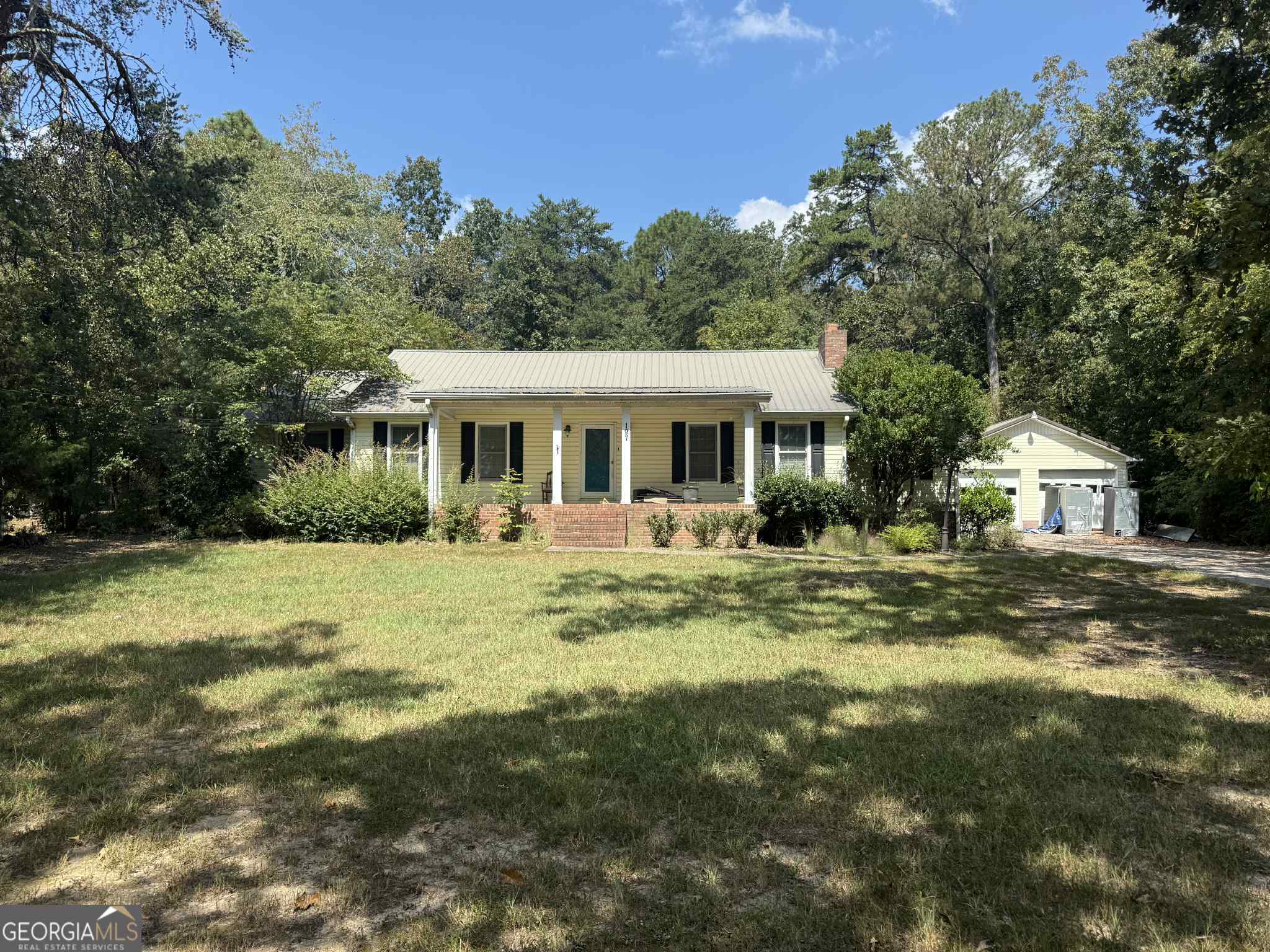 3-bedroom, 2-bath home with 2,008 sq ft on 0.68 acres in Rockmart. Built in 1980, this property includes a 2-car detached garage, fireplace, metal roof, screened back porch, rear deck, and underground pool requiring repair. Conveniently located near schools, shopping, and major routes. This porperty is in need of cosmetic repairs. More interior pcitures coming soon.