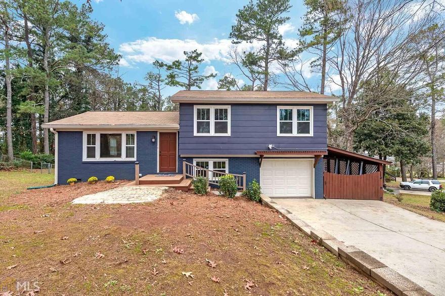 Stunning renovation!  Nestled on a corner lot in desirable East Cobb, this split-level beauty has been impeccably designed.  This unique home is highlighted with hardwood floors, designer light fixtures and tile, custom cabinetry, new windows and one-of-kind upgrades throughout.  The completely remodeled kitchen features white shaker cabinets, granite countertops, stainless appliances and pass-through overlooking the stone-tiled sunroom. Every inch of the upstairs bathroom has been renewed with contemporary accents, including patterned floor tile, stained wood vanity and rainfall shower head.  All three of the spacious upstairs bedrooms feature new ceiling fans and closet lighting. The epoxy-floored lower level includes many showstopping highlights!  The spa-like downstairs bathroom features a 72” soaking tub, enclosed by frameless glass doors. The bedroom is highlighted with built-in shelves and custom barnwood ceiling. The laundry room includes sliding door cabinets, pull out pantry, laundry basket storage and penny countertop folding area.  The garage features a workshop, sliding wood doors, recycling center and space for extra freezer/fridge. The exterior includes brick deck, large outbuilding and enclosed carport that doubles as entertainment space. Other features, tankless hot water heater and extra insulation. Seller will be accepting offers until 5pm Monday Dec. 28th.