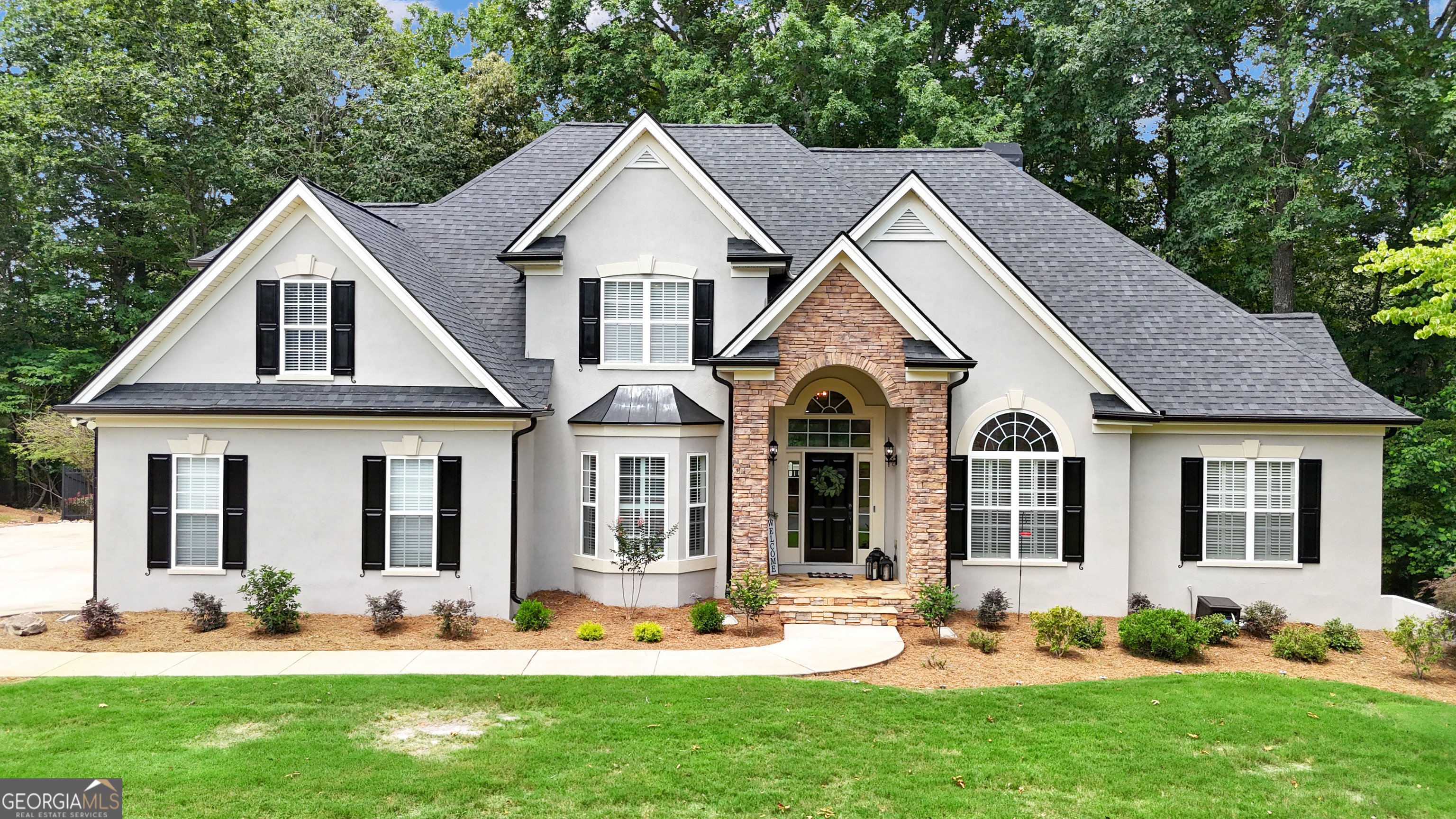 Located in North Peachtree City's highly desirable Kedron Estates community, this updated and move-in ready home offers style & comfort. The main level features a spacious great room with soaring ceilings perfect for everyday living & entertaining. It flows into the chef's kitchen with sleek quartz countertops and stainless steel appliances. Enjoy working from home in the dedicated office. A large primary suite on the main is the perfect place to relax with a tranquil spa-like bath. Upstairs are 3 generously sized bedrooms. One includes a private ensuite bath and the other two share a Jack and Jill bath. The terrace level is designed for entertainment and fun, boasting a large media room, a billiard area and a stylish bar that opens to the backyard oasis. Enjoy the ultimate staycation lounging by the pool surrounded by trees for privacy. Updates include new roof, new kitchen, new landscaping, new interior & exterior paint, new carpet, new tankless hot water heater and new lighting. Gorgeous plantation shutters! Hardwood floors throughout main floor! Convenience to shopping & restaurants, award-winning schools and 100+ miles of multi path system make this the perfect place to call home. Call to arrange your arrange your private showing.