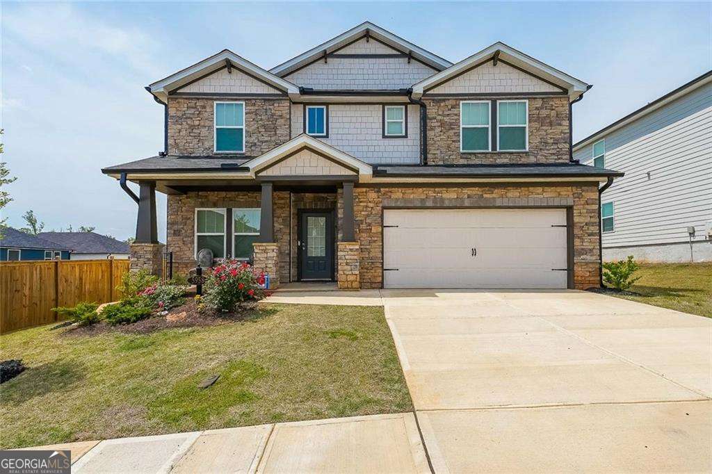 Imposing, like new, stoned fronted, move-in ready, energy efficient 3007 sq ft 5BR 3 FULL BATH home with large privately fence backyard. Home has natural lighting throughout as well as neutral color. The main level has a uniquely-placed flex room that can serve as a formal dining room, home office, additional bedroom or a meeting room. A chef's kitchen is enhanced by marble countertops and stainless steel appliances while a large walk-in pantry, and a sliding glass door opens to a large fenced landscaped backyard. Across from the kitchen/dining area is a spacious living area, with a log burning fireplace. This makes the main floor perfect for entertaining. On that same floor is a bedroom with a full bathroom making it convenient for guests. Upstairs, an oversized loft provides flexible bonus space suitable for a gameroom, a media room, play area or office/s. The master bedroom also upstairs features a spa-like soaking tub and a large walk-in closet. Three additional bedrooms are on the upstairs floor. The home is close to schools, churches, steakhouses, restaurants, pharmacies, schools, Buford Mall, places of worship, Kroger, Publix, etc. It is also a few minutes from medical facilities like Piedmont Healthcare Systems, Northeast Medical center, movie theatres, Lake Lanier, etc. All personal property is excluded.
