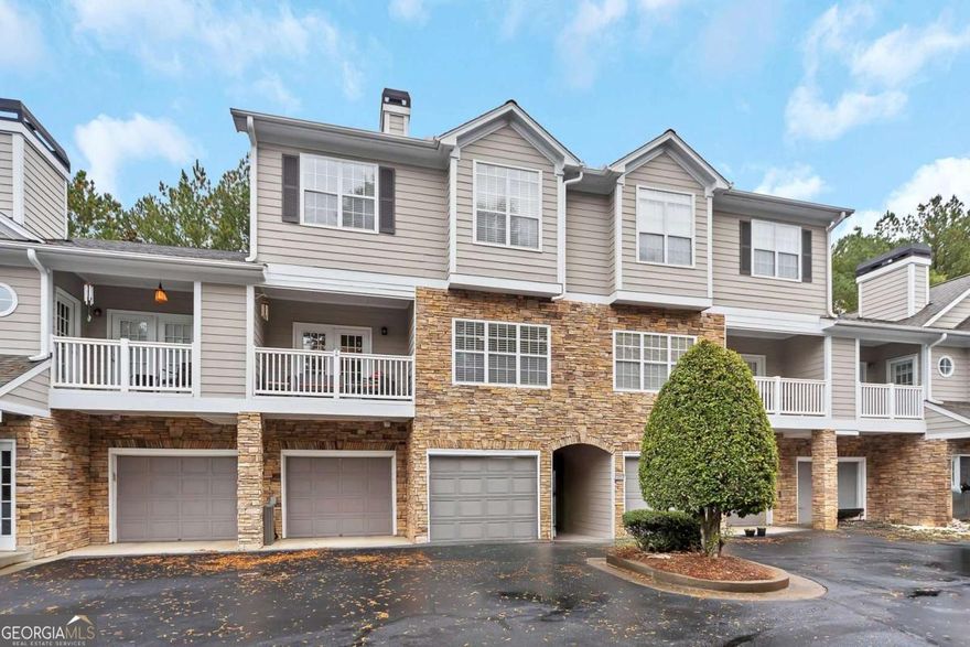 Beautifully updated condo located in The Crossings at Towne Lake-a well-maintained enclave of just 40 homes conveniently situated in the heart of Towne Lake. Enjoy a walkable lifestyle with easy access to shopping, dining, and the GreenPrints Trail System. From the covered entry, step into the inviting foyer that opens to a bright family room featuring a cozy fireplace and serene views of the natural area out back. The updated kitchen offers white cabinetry, granite countertops, stainless steel appliances, and a convenient breakfast bar. The adjacent dining area provides access to the rear patio-perfect for relaxing and enjoying the peaceful, wooded surroundings. A laundry room with storage (washer and dryer included), a guest half bath, and a spacious storage closet complete the main level. Upstairs, the primary suite features a vaulted ceiling, walk-in closet, and ensuite bath with a double vanity, tub, and shower. The secondary bedroom is generously sized and includes a walk-in closet and private bath. Residents enjoy a charming community gazebo ideal for relaxing or gathering with friends. This move-in-ready home offers comfort, convenience, and low-maintenance living-just minutes from all that Woodstock and Towne Lake have to offer.