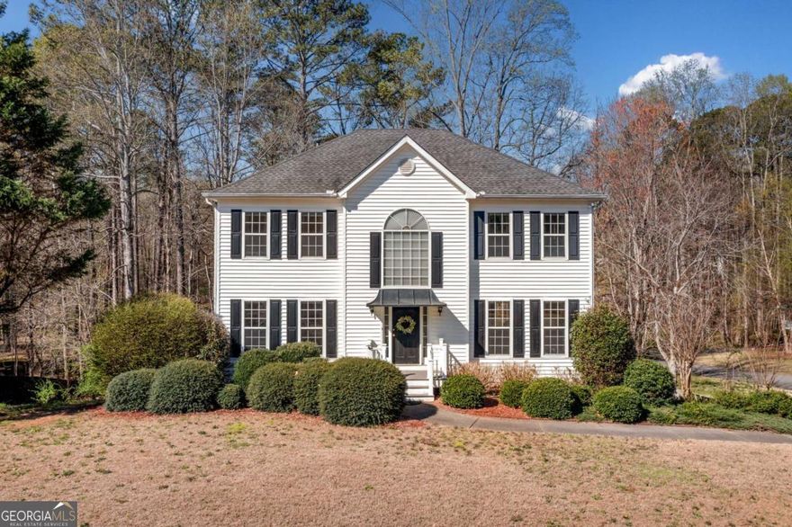 Sunlit home on a landscaped corner lot retreat. Step into the two-story foyer where natural light pours in, leading you to a kitchen designed for real life - stone countertops, a sleek tile backsplash, and plenty of cabinetry to keep everything within reach. Host dinner in the formal dining room or gather by the fireplace in the family room. Need a quiet workspace? The front living room offers the flexibility of a home office with an open, airy vibe. Outside, a composite deck and barbecue make entertaining easy, while the private backyard and gentle stream set the scene for peaceful mornings and reflective evenings. Upstairs, the oversized primary suite features a tray ceiling, walk-in closet, and a spacious en-suite bath with dual vanities, a soaking tub, and a separate shower. Three additional bedrooms catch the morning light and offer room to grow. Downstairs, the basement is ready for weekend projects or creative pursuits. Community perks include a pool, playground, and trails and you're just minutes from Downtown Woodstock and The Outlet Shoppes of Atlanta. Located in the sought-after Sequoyah High School District.