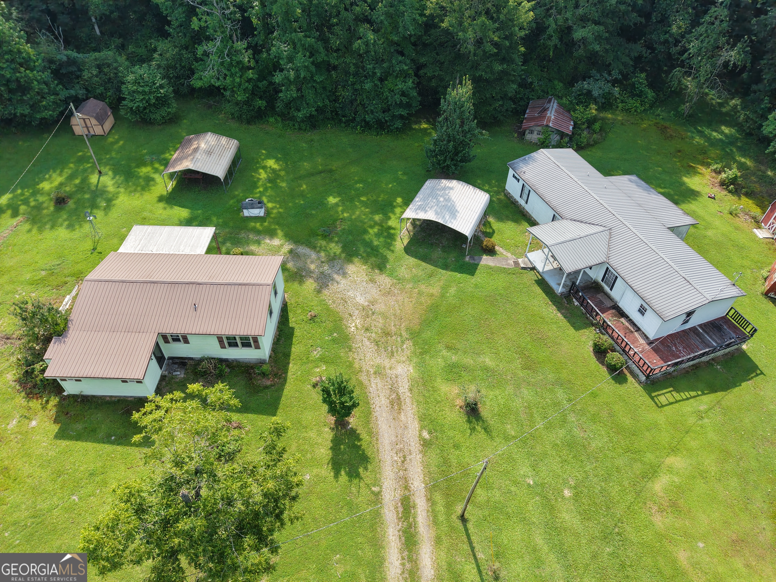 Two homes included in a desirable Brooks location - perfect for multi-generational living, rental income, or investment potential. Property is being sold As Is.