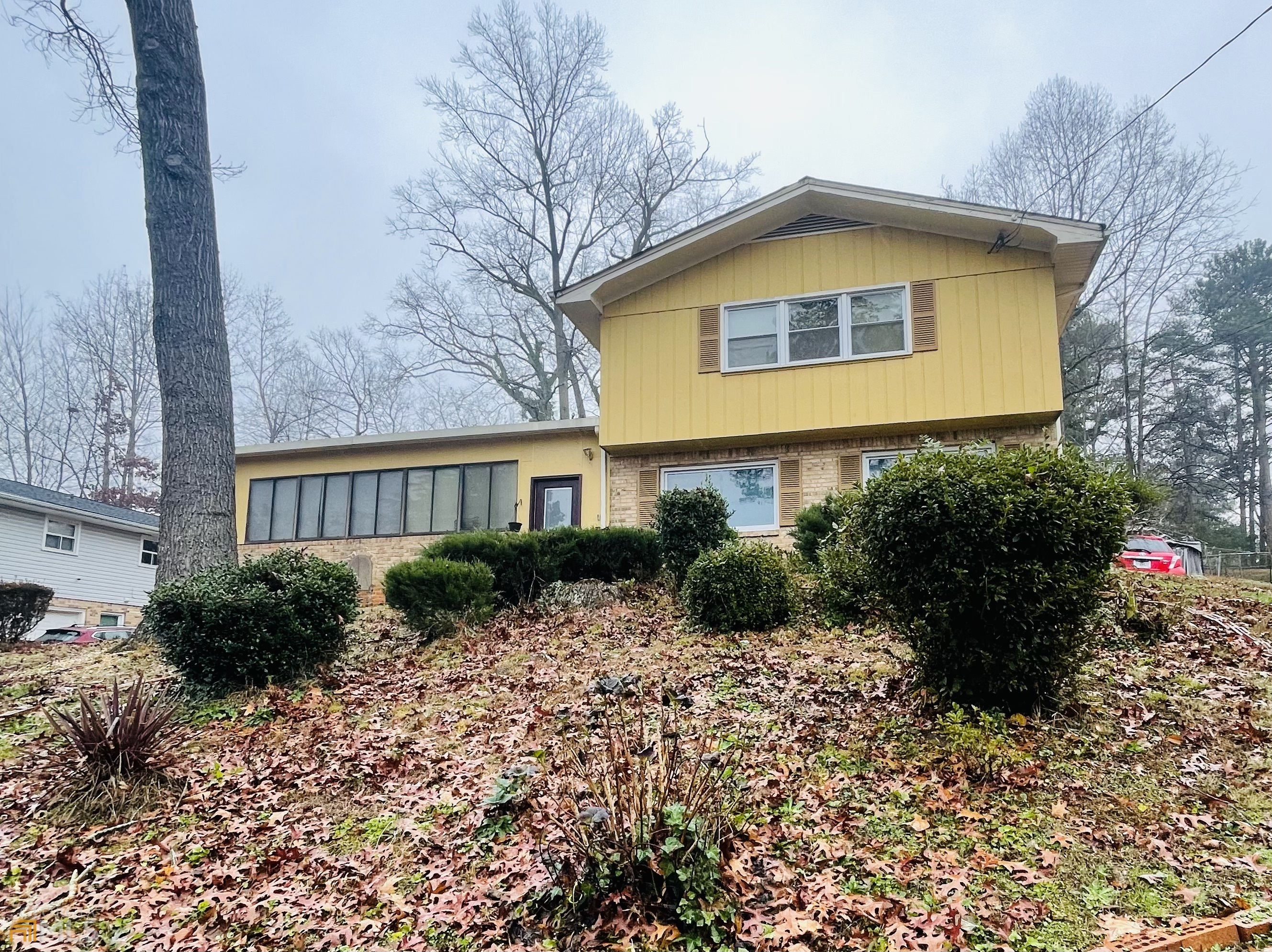 This is a must-see Beautifully Maintained Brick Split-Level Home! Located just minutes from Shopping, Dining and more! Easy highway access! This home offers Light-Filled Interiors and a flowing floorplan made for entertaining. Meals are made easy in the updated Eat-In Kitchen with Stainless Steel Appliances, Granite Countertops, and an island for family to gather around that flows into a Fireside Family Room with rear patio access. Primary Suite is spacious with a Private Ensuite Bathroom. Three additional Bedrooms share a Hall Bathroom. Downstairs offers flexible living space. Outdoor Entertaining is easy with an oversized backyard. A One-Car Garage welcomes you home. Minutes to Multiple Parks, Hartsfield Jackson International Airport, and more with Easy I-20 and I-285 access!