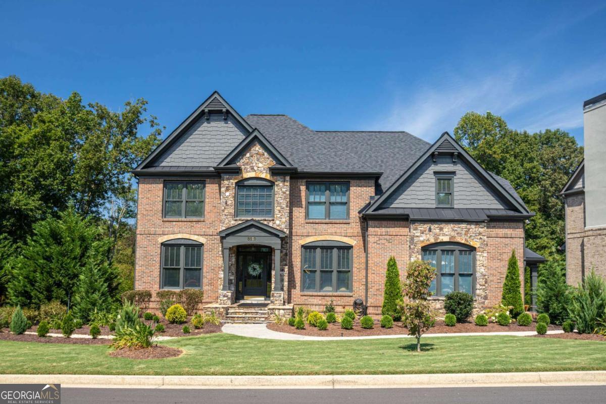 This impressive 7-bedroom, 5-bathroom residence offers nearly 4,000 square feet of elegant living space tucked away in the coveted Polo Golf & Country Club in Forsyth County. Built in 2003 and recently updated with classic finishes throughout, this stately brick home strikes the perfect balance of timeless architecture, modern comfort, and resort-style amenities with mature landscaping and plenty of charm. The finished basement and main level boast multiple gathering spaces, formal and casual, plus flexibility for entertainment, guest suite, or even a home office. The well-proportioned rooms and great natural light throughout will leave you feeling refreshed. As a part of Polo Golf & Country Club, residents enjoy access to top-tier golf amenities, trails, social amenities, and a thriving community. Highly rated and sought after Forsyth County schools just add to the appeal. Schedule and appointment today to see your dream home!