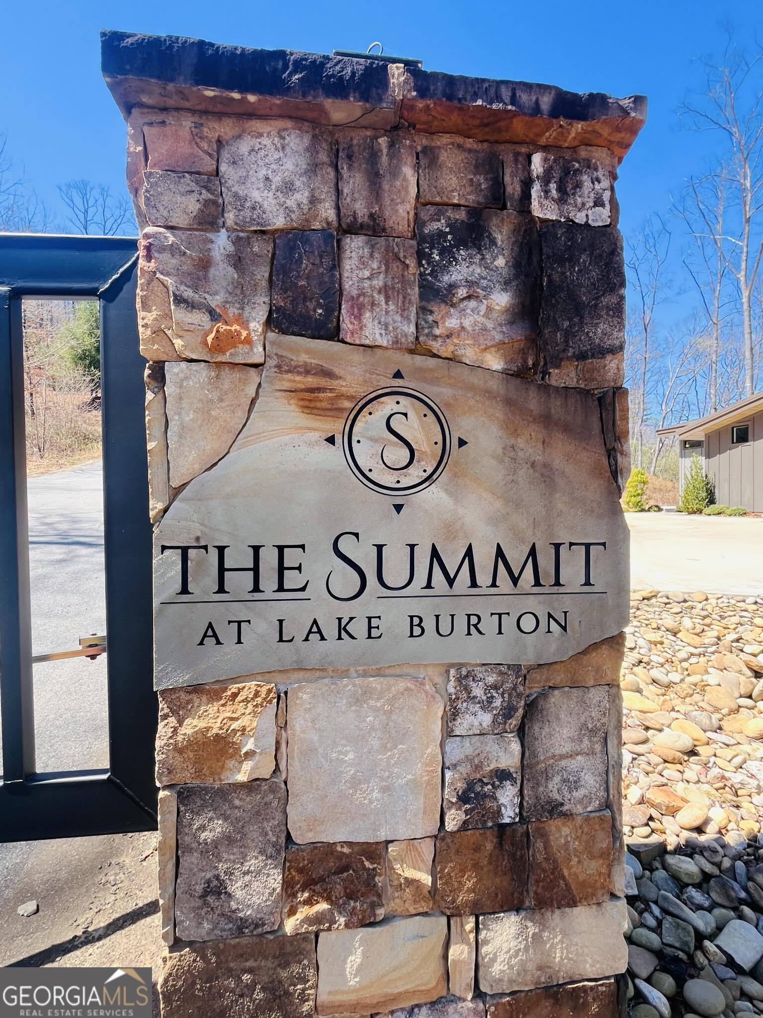 Build your dream home at "The Summit at Lake Burton," an upscale gated community across from the prestigious Lake Burton! A bonus to this lot is a creek flows gently thru the middle of the property! Seasonal views can be opened up with some tree clearing. This is a prime location as LaPrades Marina and Restaurant is within 2 miles and another boat launch at the Fish Hatchery about a mile away. You'll have access to a wealth of recreational opportunities right at your doorstep. Whether it's boating, fishing, hiking or just unwinding in the peaceful serene privacy of your mountain home! The property is convenient to The Waterfall Club and the quaint shops and restaurants of Clayton. With several homes already built in this community and more in the process you won't want to miss out! BONUS this is a FEE SIMPLE lot and SHORT TERM RENTALS are allowed! Build your dream vacation home and rent it out when you're not there! Lot 6 beside it is also available. Per Covenants if someone buys both lots, Association fee is only $500 Not $500 per lot.