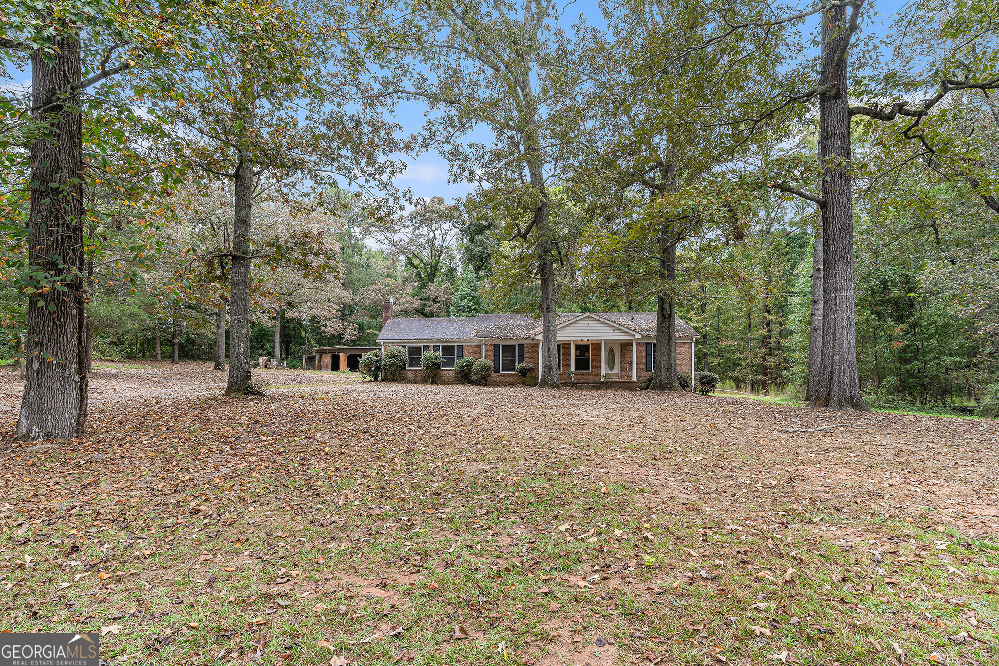 Classic Brick Ranch on 2 Acres with Outbuildings - Tons of Potential! Set back from the road on a private 2-acre lot, this 3-bedroom, 2-bath brick ranch offers the charm of country living with the convenience of being close to town. The home features a traditional single-level layout with spacious common areas, an eat-in kitchen, and plenty of natural light. Outside, you'll find a large outbuilding with endless possibilities-perfect for storage, a workshop, or hobby space-plus an additional storage building for extra convenience. The wide, level lot provides room to garden, play, or simply enjoy the peaceful surroundings. While the property will need some updates and repairs, it provides a great opportunity to create your own retreat in a desirable, accessible location. Bring your vision and make this one your own!