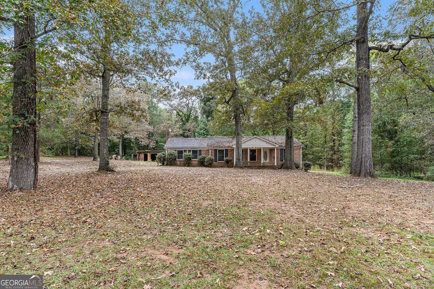 Classic Brick Ranch on 2 Acres with Outbuildings - Tons of Potential! Set back from the road on a private 2-acre lot, this 3-bedroom, 2-bath brick ranch offers the charm of country living with the convenience of being close to town. The home features a traditional single-level layout with spacious common areas, an eat-in kitchen, and plenty of natural light.  Outside, you'll find a large outbuilding with endless possibilities-perfect for storage, a workshop, or hobby space-plus an additional storage building for extra convenience. The wide, level lot provides room to garden, play, or simply enjoy the peaceful surroundings. While the property will need some updates and repairs, it provides a great opportunity to create your own retreat in a desirable, accessible location. Bring your vision and make this one your own!
