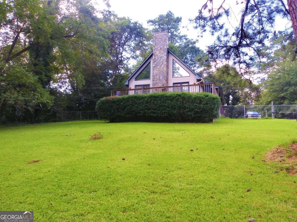 Charming A-Frame Cottage in the Heart of Ingleside Welcome to this one-of-a-kind A-shaped cottage nestled in one of Macon's most desirable neighborhoods-Ingleside. Perfectly combining character, comfort, and privacy, this property offers a rare opportunity to own a home that feels like a retreat right in the city. Property Highlights Private Drive & Electronic Gate: Enjoy security and seclusion as you arrive home through your own gated entrance. Architectural Gem: The A-frame design, accented with soaring high-beamed ceilings, creates an airy and dramatic living space filled with natural light. Open-Concept Living: Spacious interiors designed for both relaxation and entertaining, blending rustic charm with modern convenience. Outdoor Appeal: A lush yard provides room for gardening, entertaining, or simply unwinding in peace. Prime Location: Located in the heart of Ingleside, you'll be close to boutique shops, local dining, and community favorites This home is more than a place to live-it's a lifestyle. Whether you're curling up by the window with a book, hosting friends under the vaulted beams, or exploring Ingleside's vibrant community, this cottage offers it all. Location Minutes to Ingleside Village shopping and dining Convenient to downtown Macon and major highways Highly sought-after neighborhood with timeless appeal. This house. was an airbnb favorite. Schedule your private tour today and see why this A-frame cottage on Corbin Avenue is the perfect blend of style, privacy, and location! House currently has the best tenants ever paying $2100/M. No sign on property. Please DO NOT visit property or walk around. Showing will be during DD. Thank You