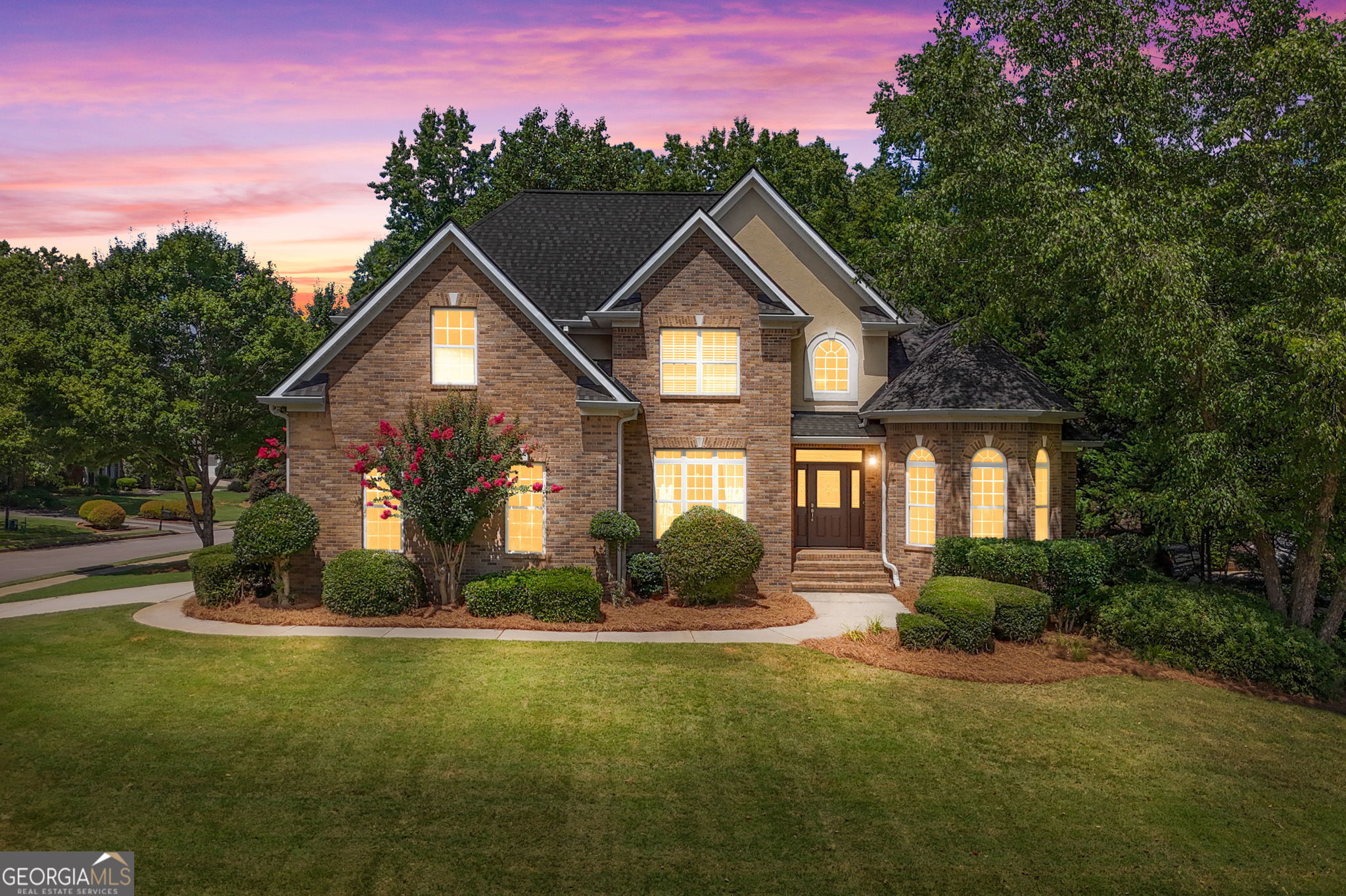 WOW!! "THE CHANCE SELLS TEAM" presents this..... Stunning 5-Bedroom/3 bath All-Brick Home in a Gated Community with Basement & Amenities...................... Welcome to your dream home! This beautiful all-brick 5-bedroom, 3-bath residence offers over 3,100 square feet of thoughtfully designed living space and sits atop a massive 2,140 sq ft unfinished basement-full of potential for future expansion. Nestled in a sought-after gated community with amenities perfect for entertainment and relaxation, this home is truly a rare find. Step inside to discover a spacious, open-concept layout featuring a large great room with soaring ceilings, new carpet, and a cozy fireplace. The chef's kitchen is a showstopper with granite countertops, a generous island, stylish backsplash, stainless steel appliances, and an inviting eat-in area that opens into a charming keeping room with a second fireplace. The main level offers convenience and luxury with a stunning primary suite complete with dual walk-in closets, a soaking tub, separate tiled shower, and dual vanities. A second bedroom and full bath on the main level are ideal for guests or multigenerational living. You'll also enjoy entertaining in the formal dining room, perfect for gatherings. Upstairs, you'll find three spacious bedrooms-each with walk-in closets-and a full bathroom, providing plenty of space for family or guests. The full unfinished basement is already stubbed for a bathroom and offers 2,140 square feet of untapped potential-ideal for a home theater, gym, workshop, or additional living space. Additional highlights include a 2-car side-entry garage, beautifully landscaped yard, and a large deck overlooking the backyard-perfect for outdoor entertaining. Don't miss your opportunity to own this spacious, elegant home in a secure, amenity-rich neighborhood. Schedule your showing today!