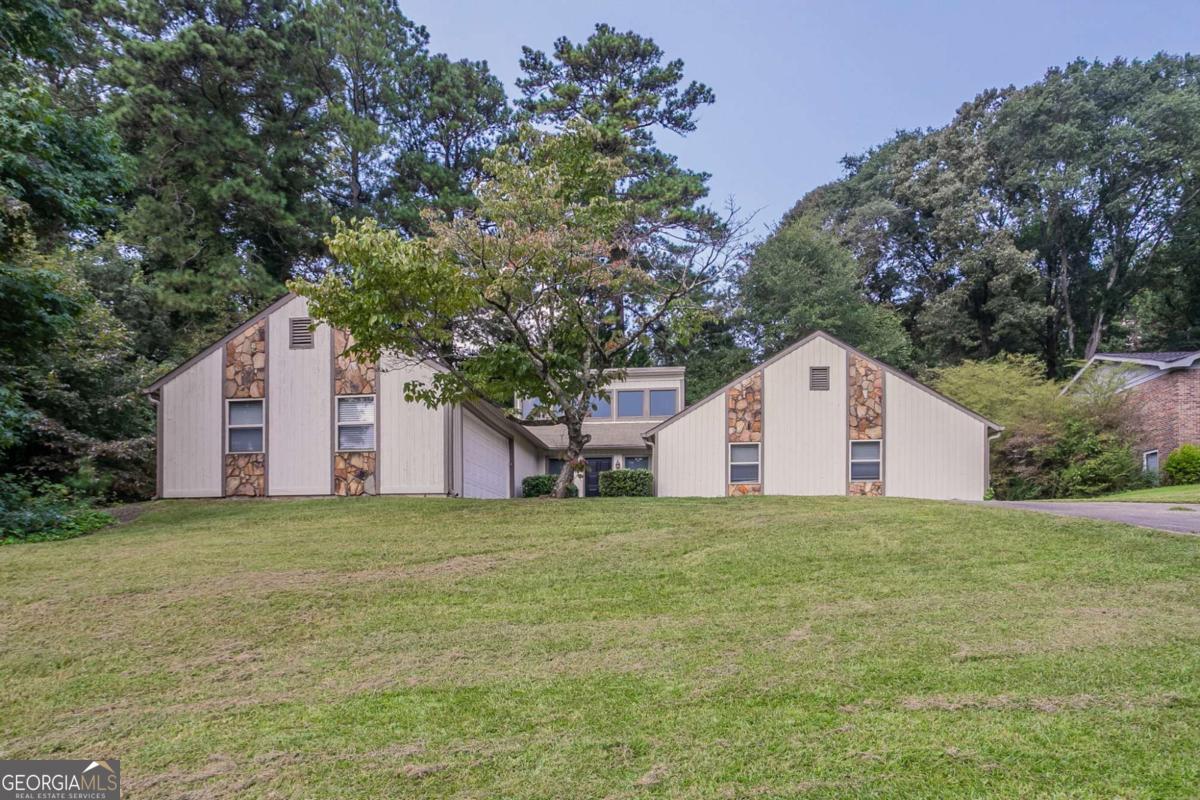 This 3BR/2BA ranch on a corner lot in the Shannon Green West community is ready for renovation. Features include vaulted ceilings in the living room, an open layout, and tons of natural light throughout. Kitchen and bathrooms need full rehab. The primary bedroom offers good space and storage, with two additional bedrooms for added flexibility. Large, level yard with mature landscaping and great curb appeal once cleaned up. Located just minutes from shopping, dining, and the Silver Comet Trail. Excellent flip or rental opportunity in a desirable part of Cobb County.