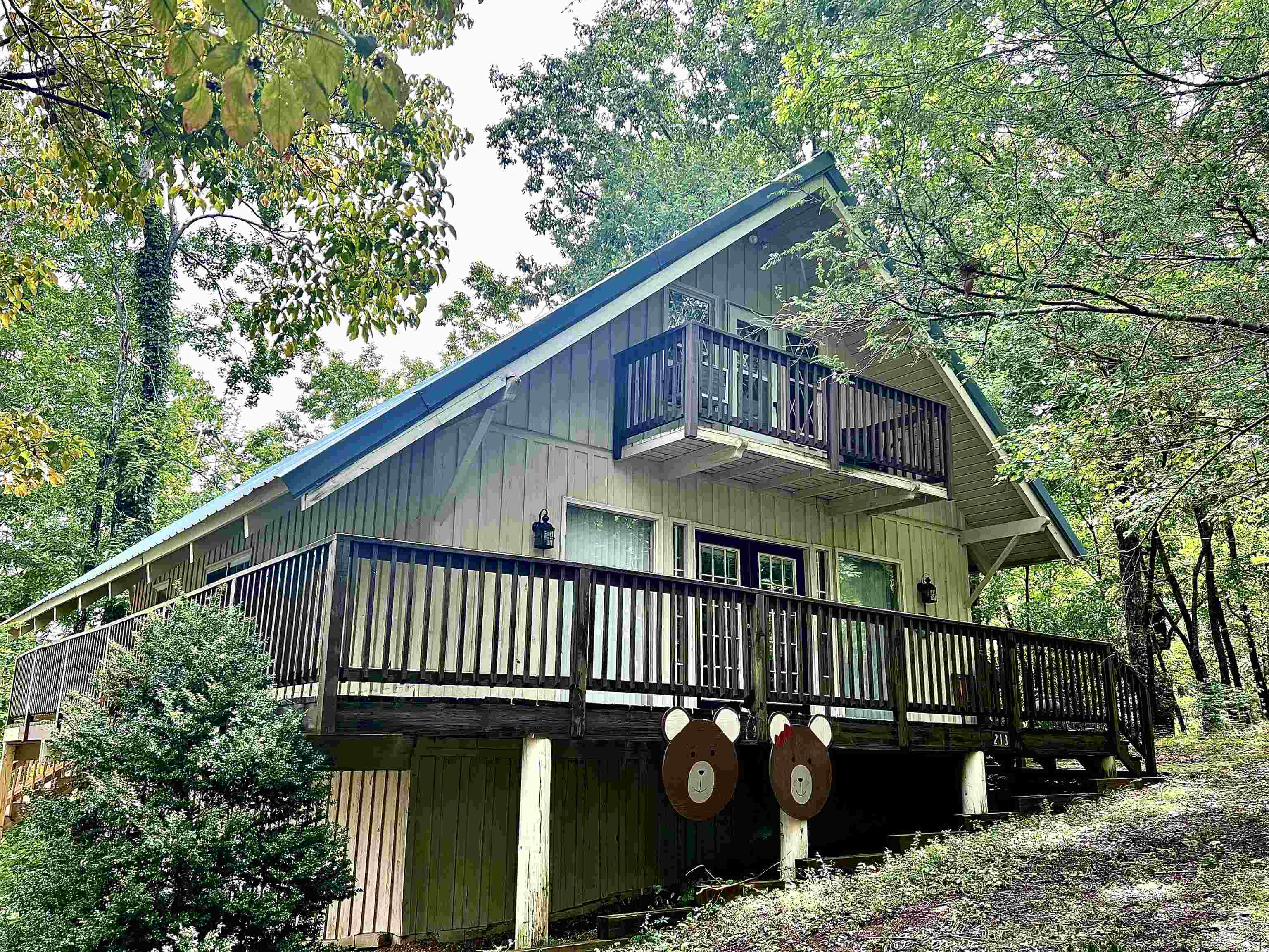 BREATHTAKING MOUNTAIN VIEWS from this 2 bedroom 2 bath home which is perfectly situated in the Swiss Colony community. Enter from the inviting rocking chair front porch, into this rustic style open floor plan kitchen, living room accented with a stone, floor to ceiling fireplace, rustic beams, and a master on main. The master bedroom is the perfect place to relax and unwind. Upstairs offers a second bedroom for friends and family, and an oversized second bathroom, complete with the laundry closet and walk in closets.The wrap around deck is where you will want to spend the majority of your time, enjoying the view and entertaining! You can see for miles! It is conveniently located in the sought after Sautee Nacoochee area, only minutes from Cleveland, Helen, local Wineries, hiking trails and waterfalls. Schedule your appointment to see it today!