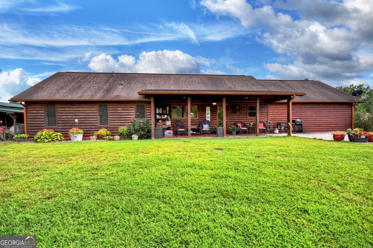 Rustic Charm Meets Modern Convenience - Just Minutes from Blue Ridge! Hard to find and full of character, this true log-sided 4-bedroom cabin offers the perfect blend of rustic charm and modern convenience. Home is handicap accessible. Nestled at the foot of the sought-after Gibbs Mountain View subdivision, this property enjoys the best of both worlds-close to a modern home development, yet outside the HOA for complete freedom and flexibility. Step inside to discover an open layout ideal for gathering with family and friends. The kitchen features a gas top stove, perfect for home chefs, while the living areas flow seamlessly for both cozy nights in and entertaining. Outside, a sprawling yard invites adventure, play, and endless leisure. With ample outbuildings for storage, plus parking in both the front and back, you'll have room for all your hobbies and gear. The home's private setting off a paved road ensures both easy access and the peaceful retreat you've been searching for. Whether you're looking for a short-term rental investment or your own full-time mountain escape, this cabin checks all the boxes. And with Blue Ridge less than 10 minutes away, you'll have quick access to dining, shopping, and outdoor adventures. Don't miss your chance to own this rare gem-a true log cabin with no HOA and unbeatable location!