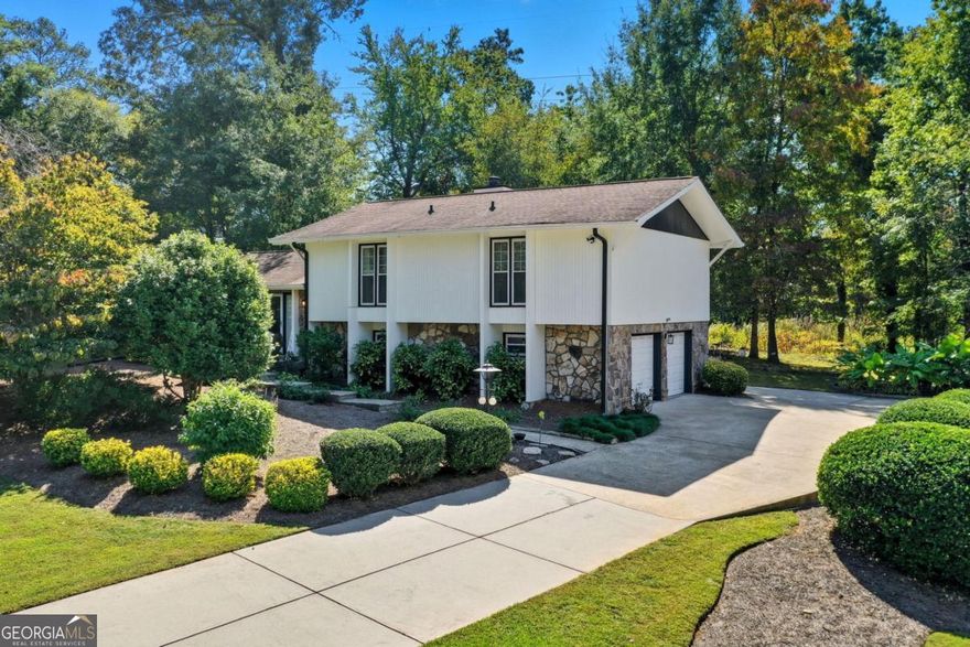 Spectacular Opportunity in Indian Hills Country Club! Welcome Home to a rare find nestled inside the prestigious Indian Hills Country Club community. Behind its unassuming exterior lies a home with serious upside, waiting for a buyer who sees both character and potential.  Set on a generous 1/4-acre flat lot, this property balances privacy and convenience in one of Marietta's most sought-after enclaves.  Inside, you'll find a layout ready for immediate enjoyment and future enhancement. The main level boasts marble floors that bring elegant durability, while hardwoods and tile throughout reinforce a premium feel. Recent upgrades remove any new homeowner worries: a brand new HVAC system throughout, a new water heater, crawl space is waterproofed and has a lifetime warranty through Aquaguard, California Closets in all bedrooms, and fully remodeled bathrooms ensure you're not chasing mechanicals out of the gate.  Rooms are bright and anchored by neutral finishes. The bones are solid, and this home invites personalization - whether you want to modernize further, expand, or simply live comfortably as is.  Rare chance to secure a prime lot in the coveted Indian Hills Country Club community, perfectly positioned in the Walton High School district (one of Cobb County's top-rated high schools).  From the moment you pull up, you sense possibilities. This isn't just about what's here now - it's about what this aggressively priced gem in Indian Hills could become. If you're browsing Zillow listings, let this one surprise you. Investors, move-in buyers, or value seekers - all have something to love here. Welcome Home!