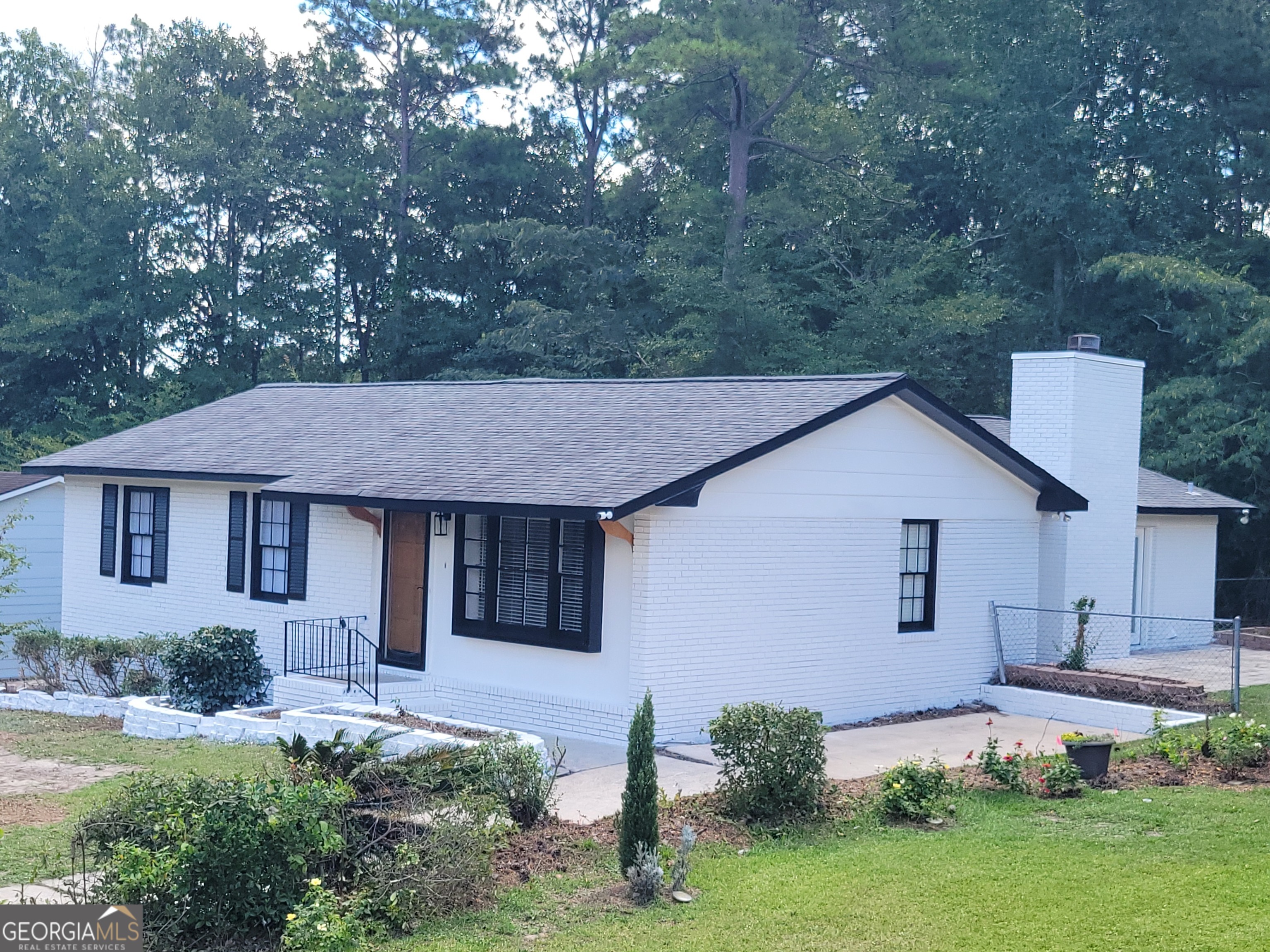 Do not miss this unique opportunity in desirable Jones County. This home has been renovated inside and out, and is completely move-in ready, NO CARPET!! This 4BR/2.5BA home has over 1800sf of living space, and features TWO spacious living areas and a large master bedroom with his/her closets, 1 full bath in the master's suite with an additional closet. This home features a large great room/entertainment room with a fireplace, a half bath, a patio outside of the greatroom/entertainment room, and a fenced backyard. This one is a must see, so please schedule your viewing today!!!