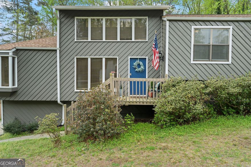 Incredible Opportunity in Top East Cobb Schools - Sope Creek ES, Dickerson MS & Walton HS!  Spacious contemporary home offering over 2,600 square feet of living space on a usable fenced 0.6-acre lot surrounded by mature trees for a pretty view and privacy. This home has 4 bedrooms and 3 full bathrooms, new decks, vaulted ceilings, fresh paint, updated flooring, a renovated kitchen  that opens to a bright and sunny floor plan. New roof to go on before closing.  Upstairs, a versatile loft makes the perfect home office or study area. The lower level includes a generously sized flex space and a third full bath-great for guests, a media room, or additional living space.  Located in a quiet, established neighborhood with no HOA, just minutes from trails and water activities at the Chattahoochee River National Recreation Area. You'll also love the top-rated schools, shopping, dining, and major highways all nearby.