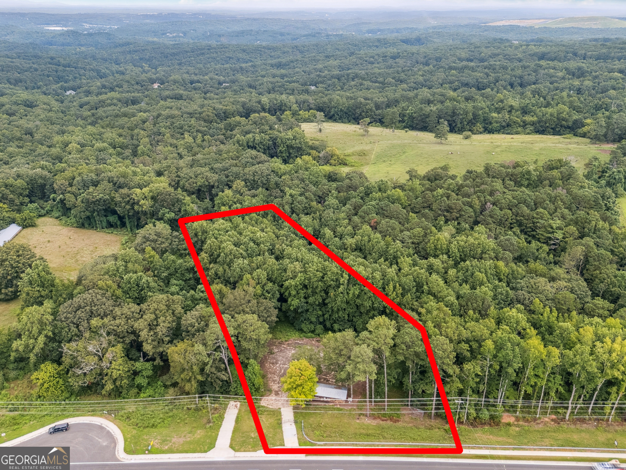 Unleash the possibilities with this prime 1.6-acre commercial development opportunity on Highway 20 in Canton! Situated within the highly desirable Highway 20 Overlay District, this parcel offers significant commercial potential for a variety of uses, despite its current R80 zoning. Consider the strategic advantage of acquiring the adjacent 3.29-acre parcel as well, creating a substantial 4.89-acre site. Benefit from high visibility and accessibility in a rapidly growing area with consistent appreciation in property values. Explore possibilities for retail, office, or mixed-use development, in line with the Overlay's guidelines for vibrant commercial growth. This is an exceptional chance to secure a strategic location for your next venture in Canton's thriving market with option to expand for greater impact.